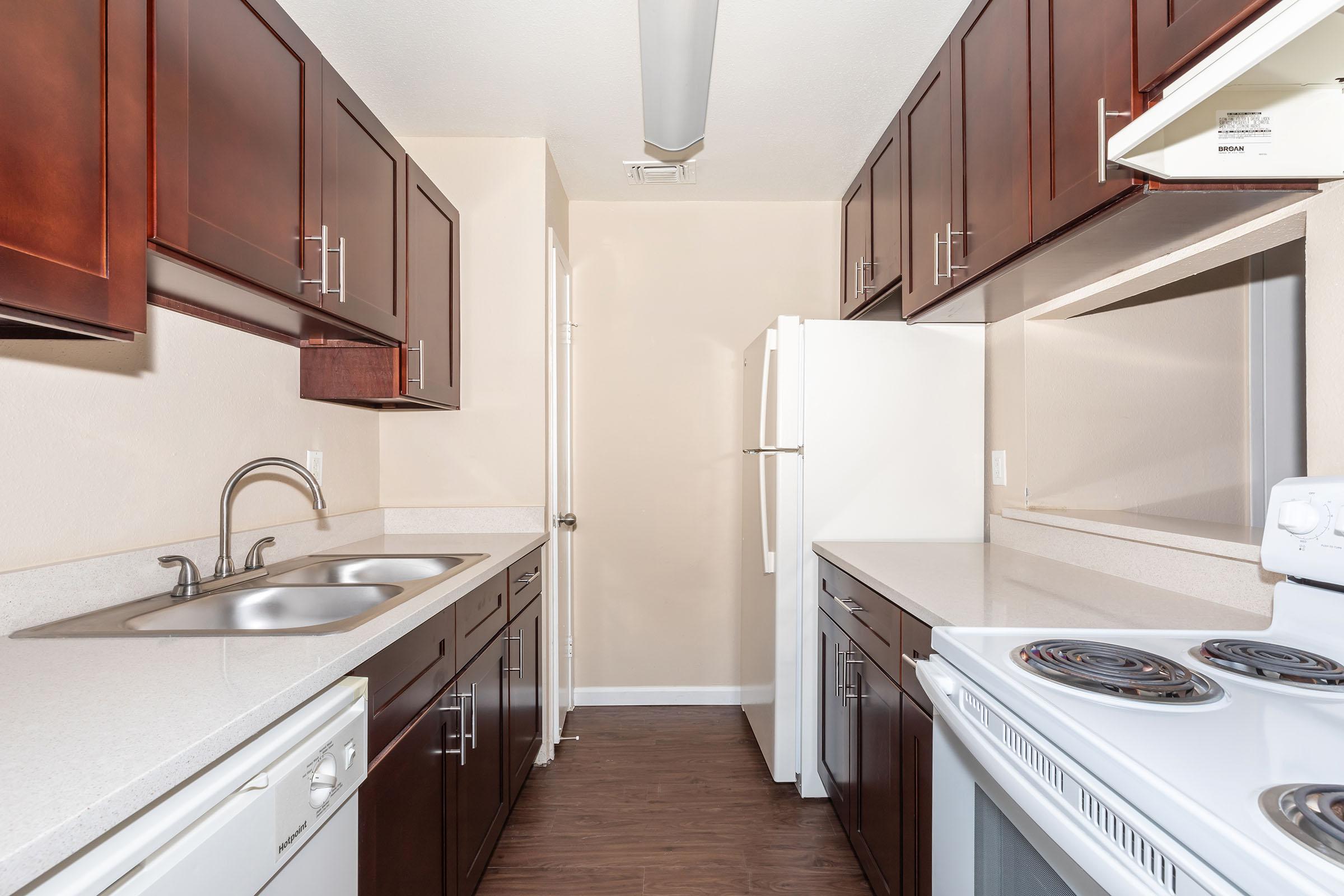 a kitchen with a stove top oven sitting inside of a refrigerator