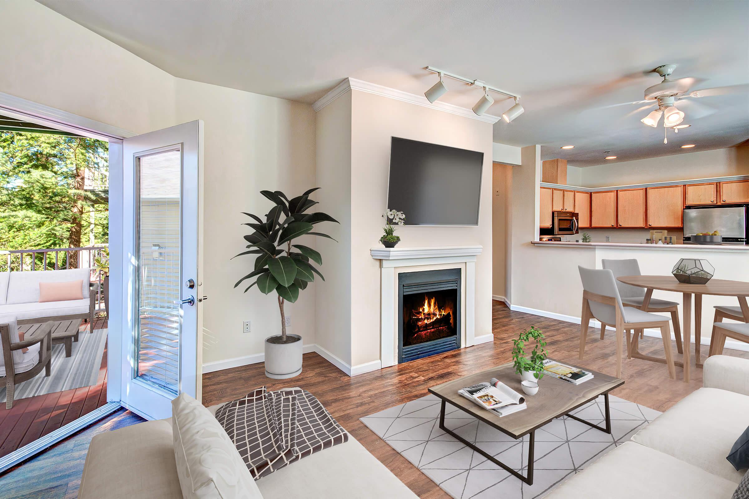 a living room filled with furniture and a fire place