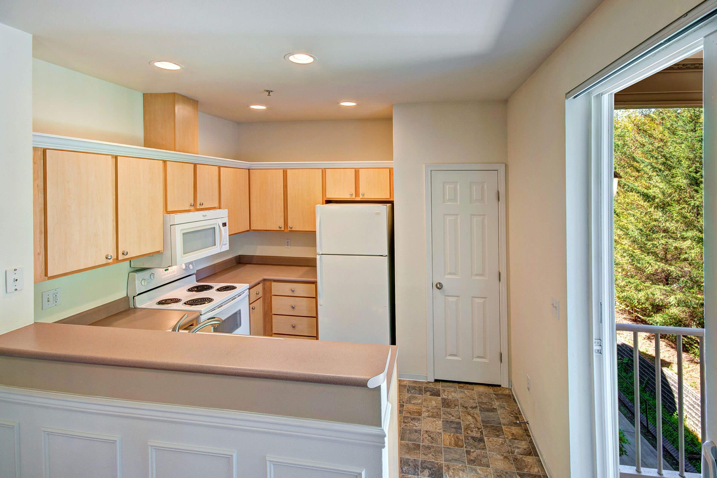 a kitchen with a large window