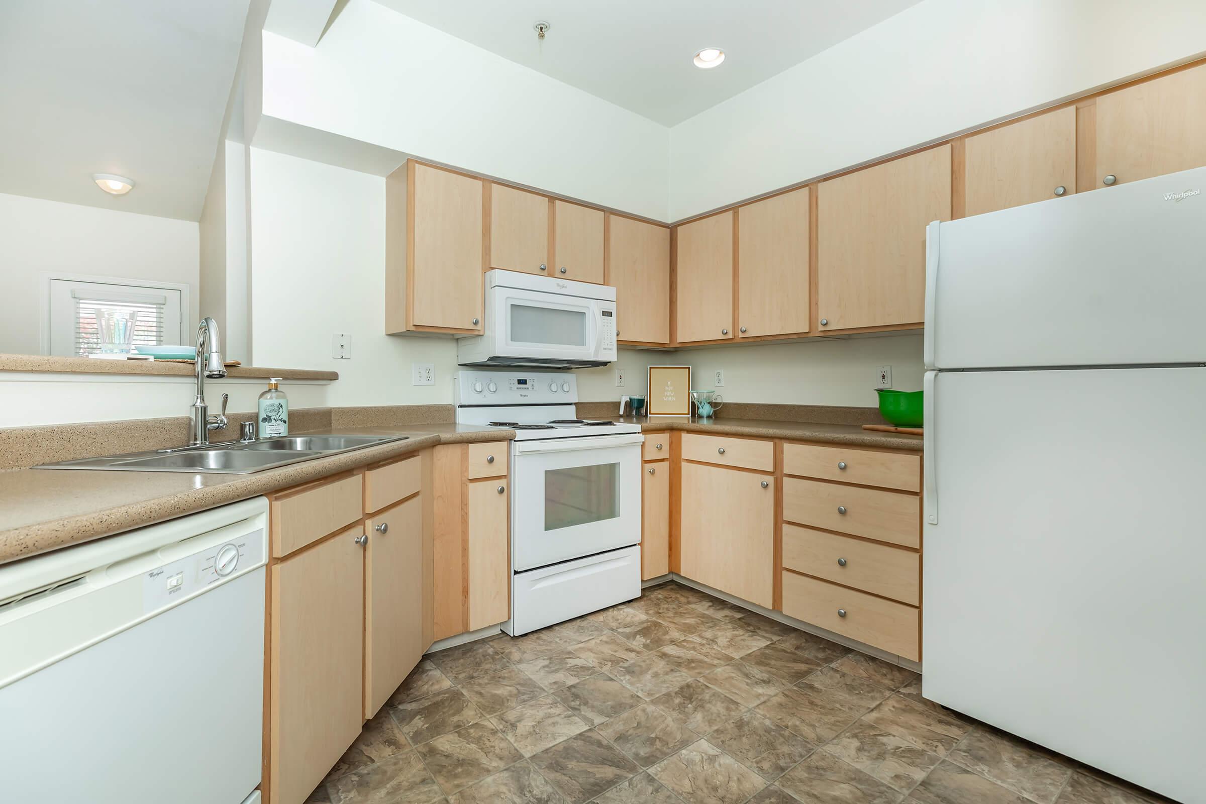 a kitchen with a stove and a refrigerator