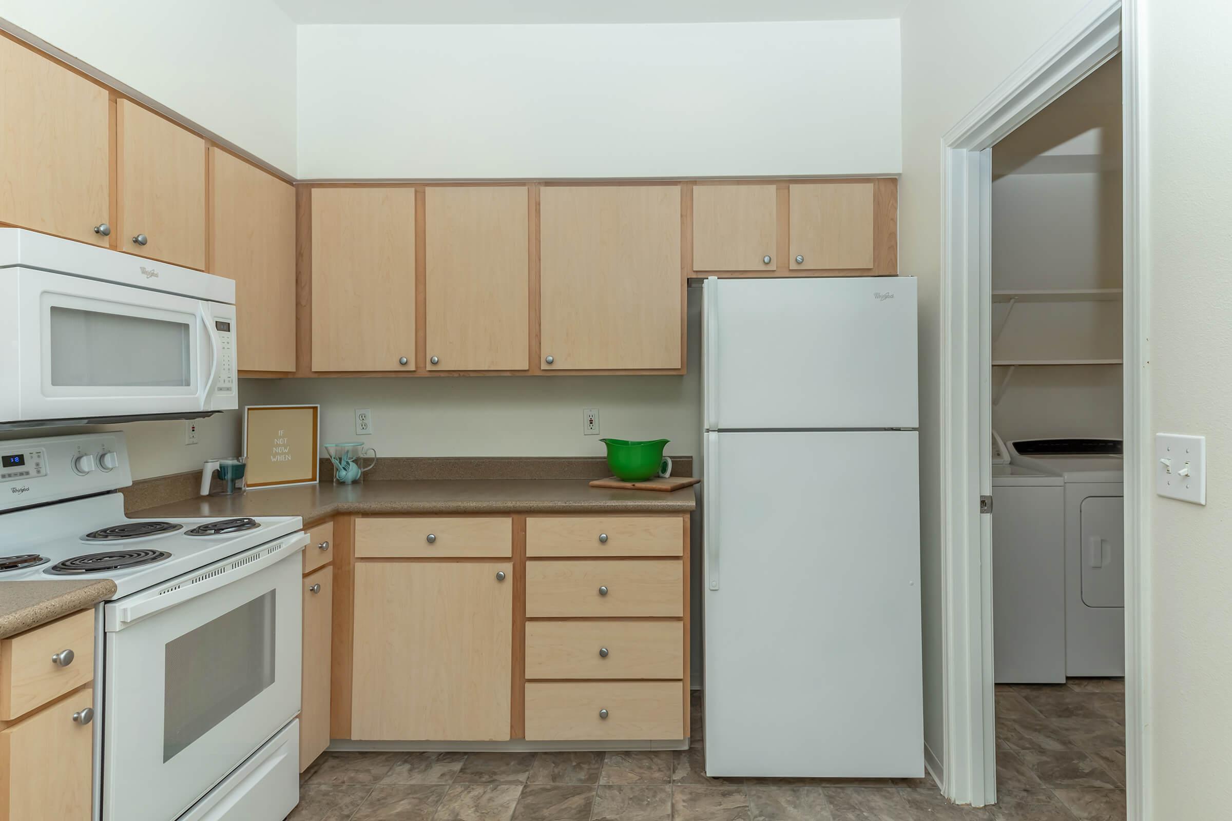 a kitchen with a stove top oven