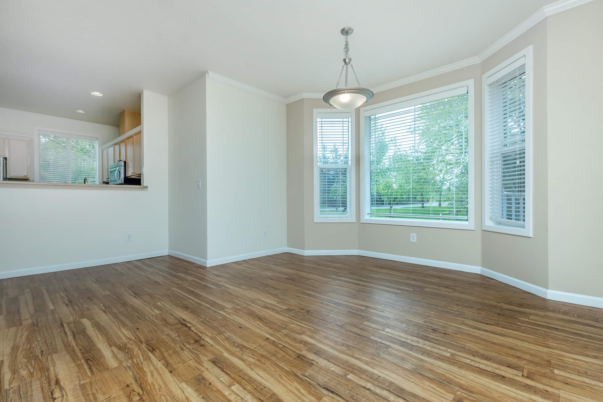 a large empty room with a wooden floor