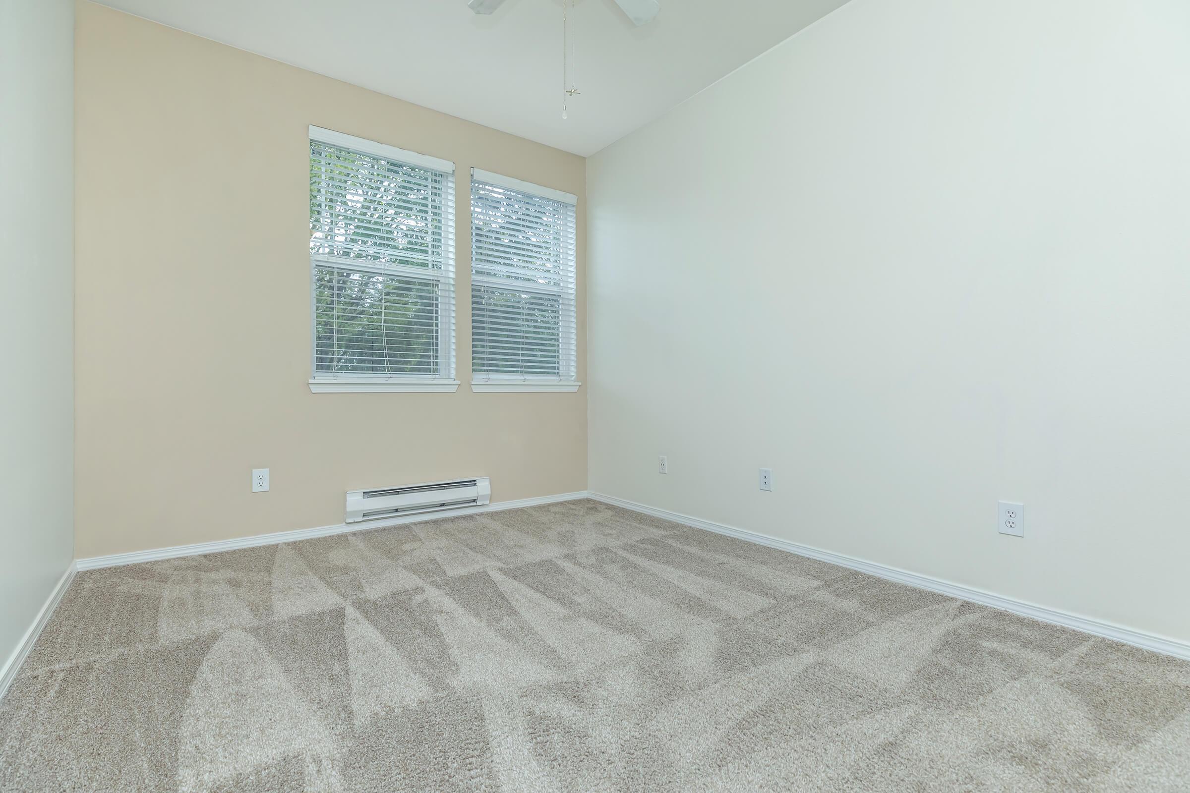 a bedroom with a large window