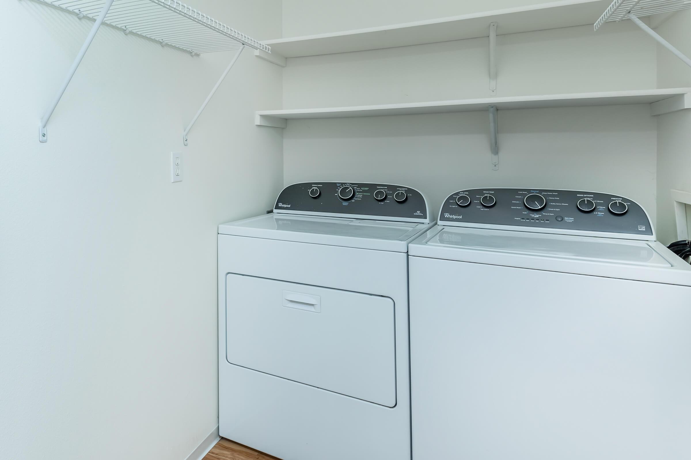 a stove top oven sitting inside of a kitchen