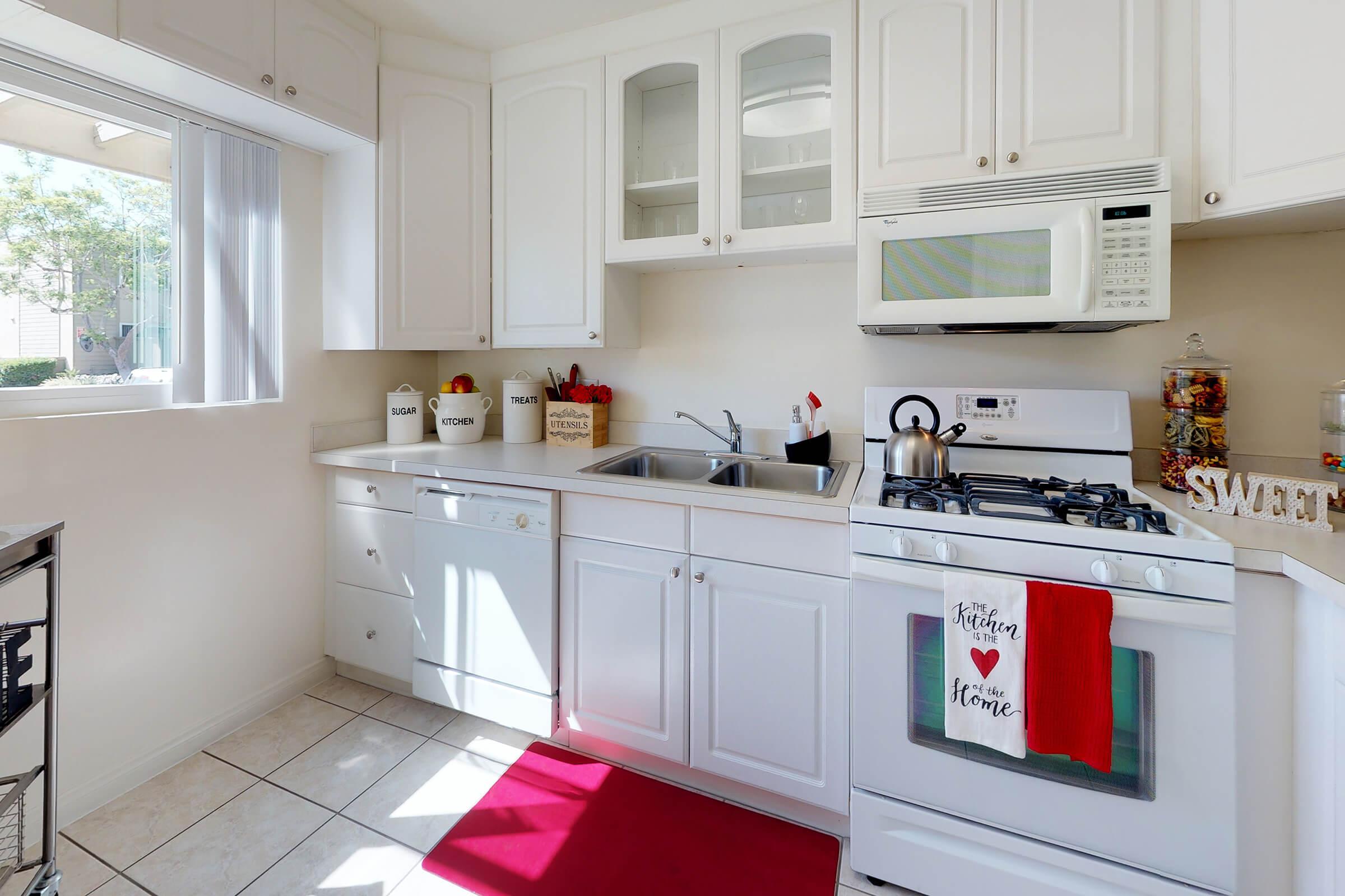 a kitchen with a sink and a window