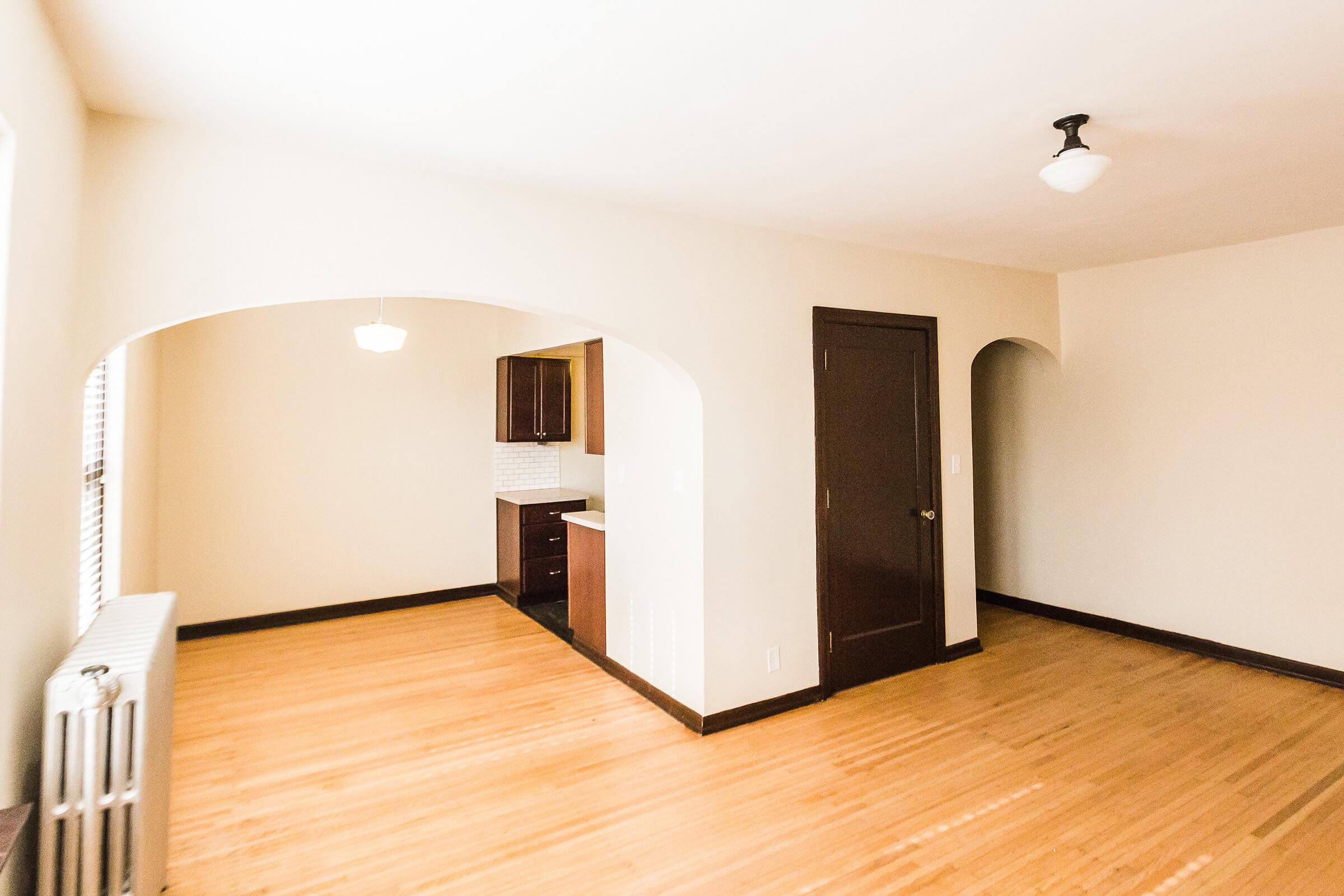 a kitchen with a wood floor