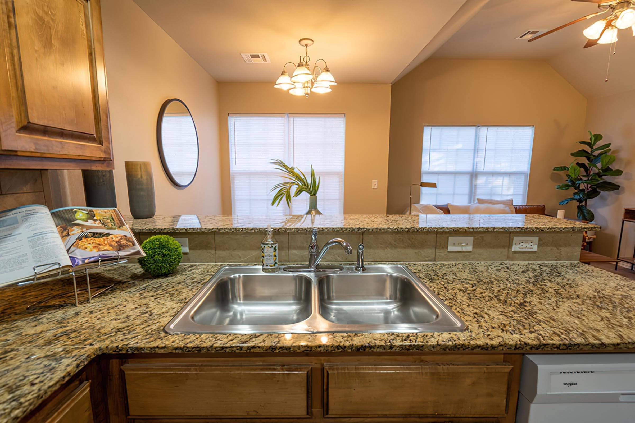 a kitchen with a sink and a window