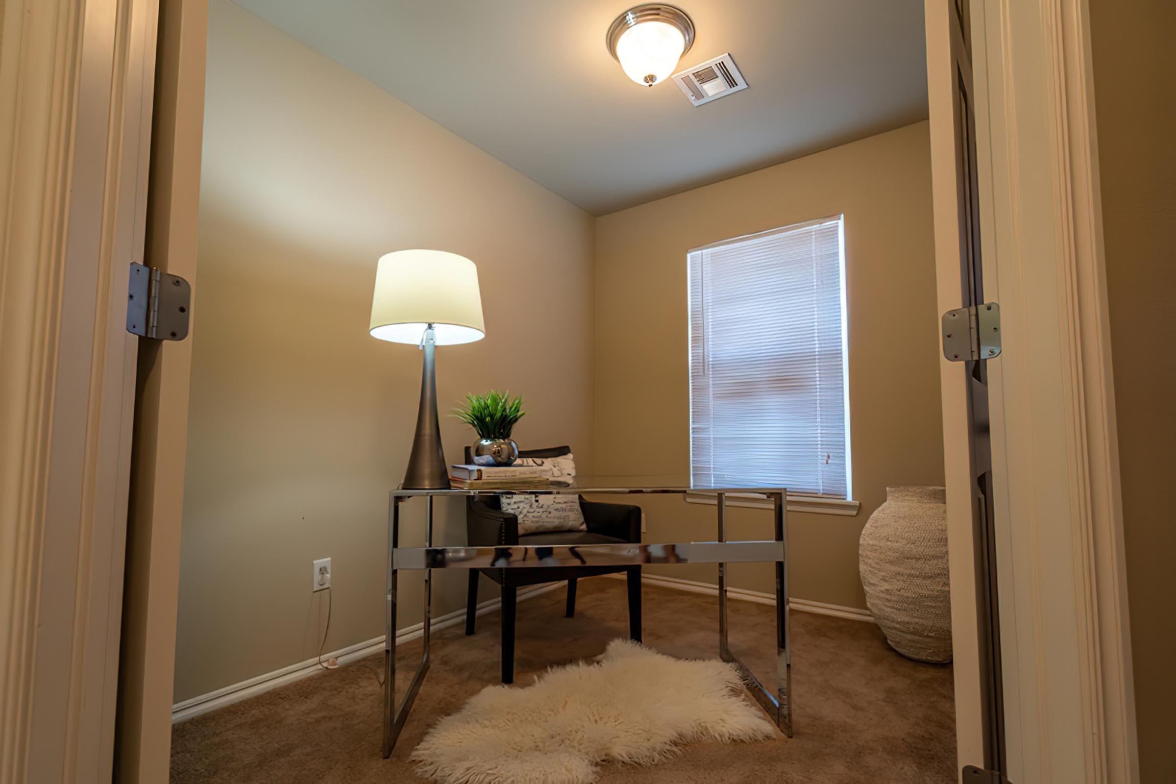 a bedroom with a bed and a mirror in a room