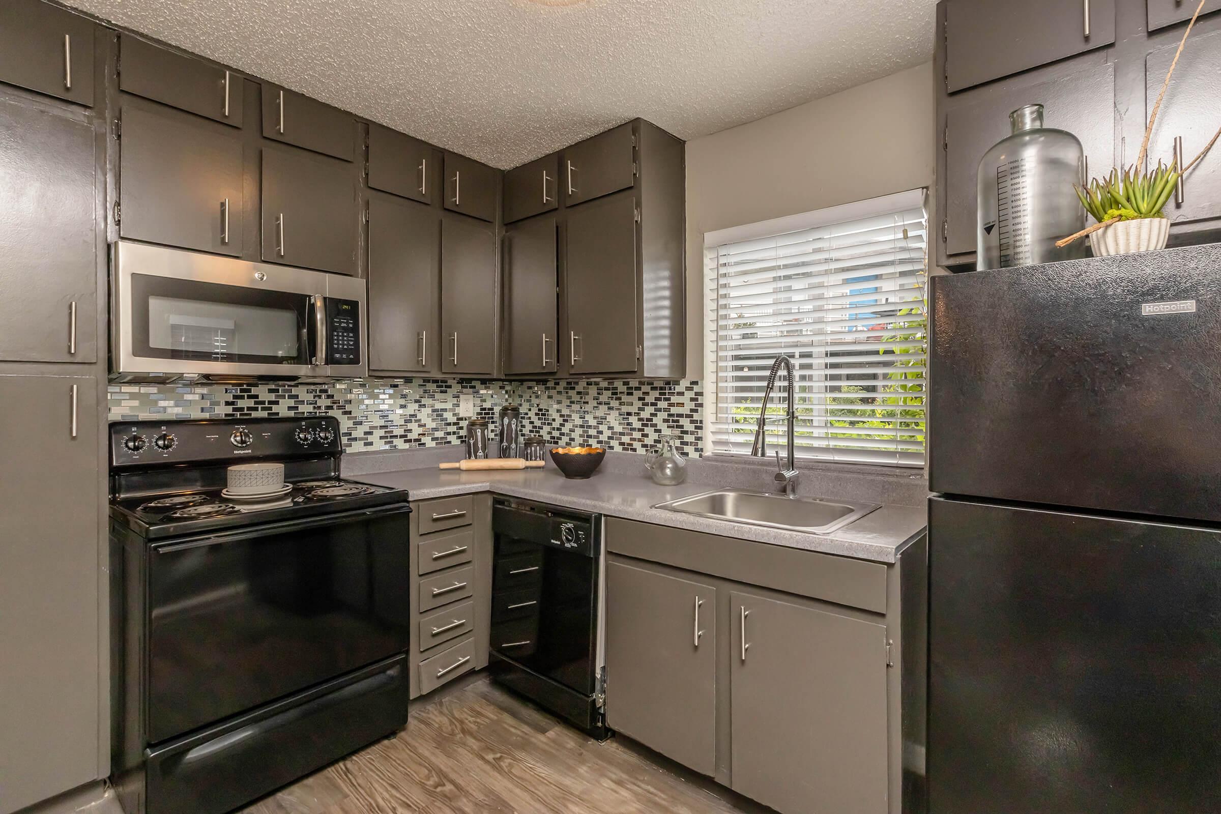 a large kitchen with stainless steel appliances