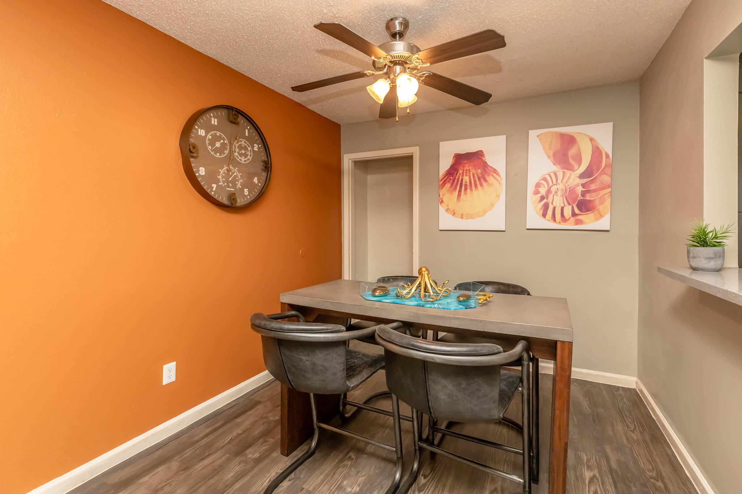 a room that has a clock on a table