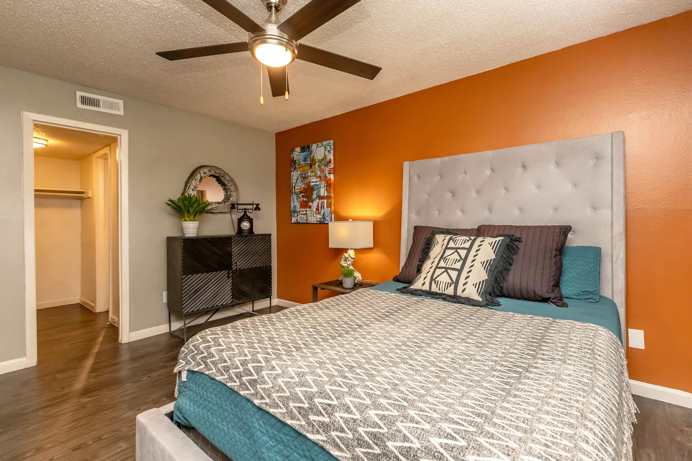 a living room filled with furniture and a bed