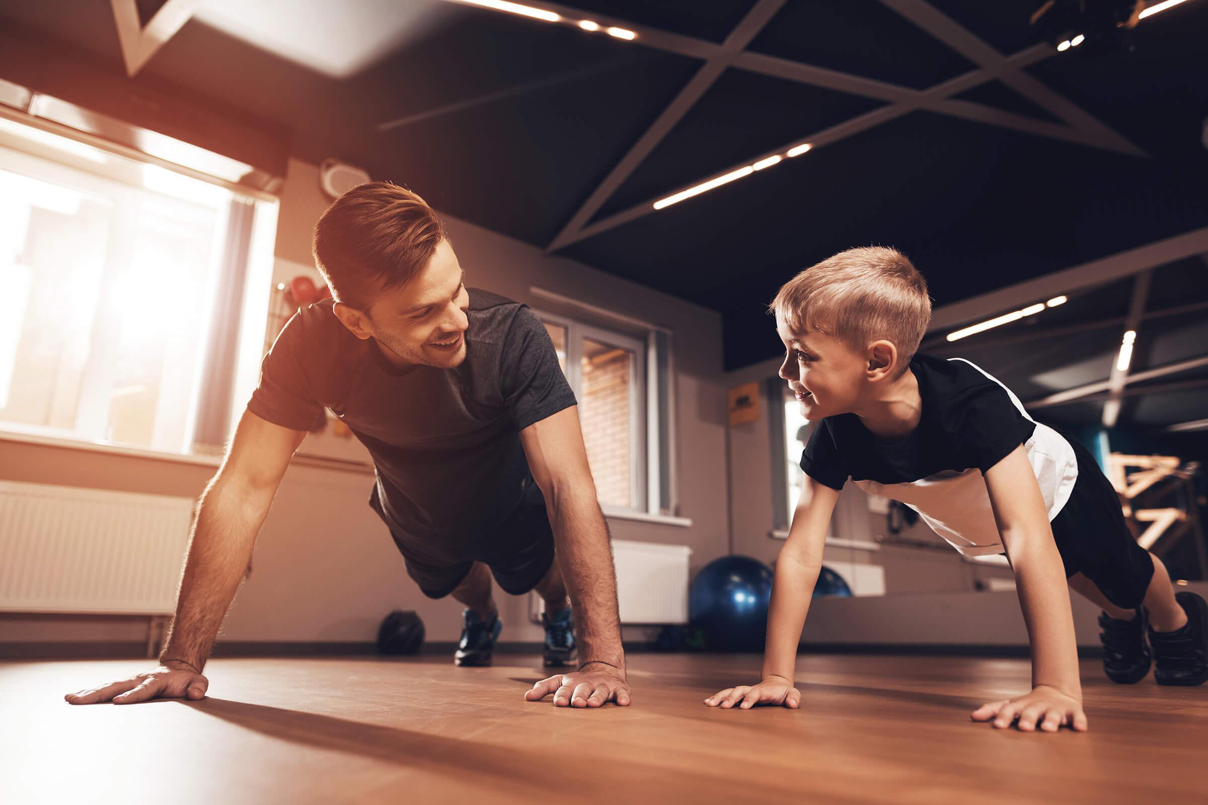Father and son in the gym GettyImages-906032942.jpg
