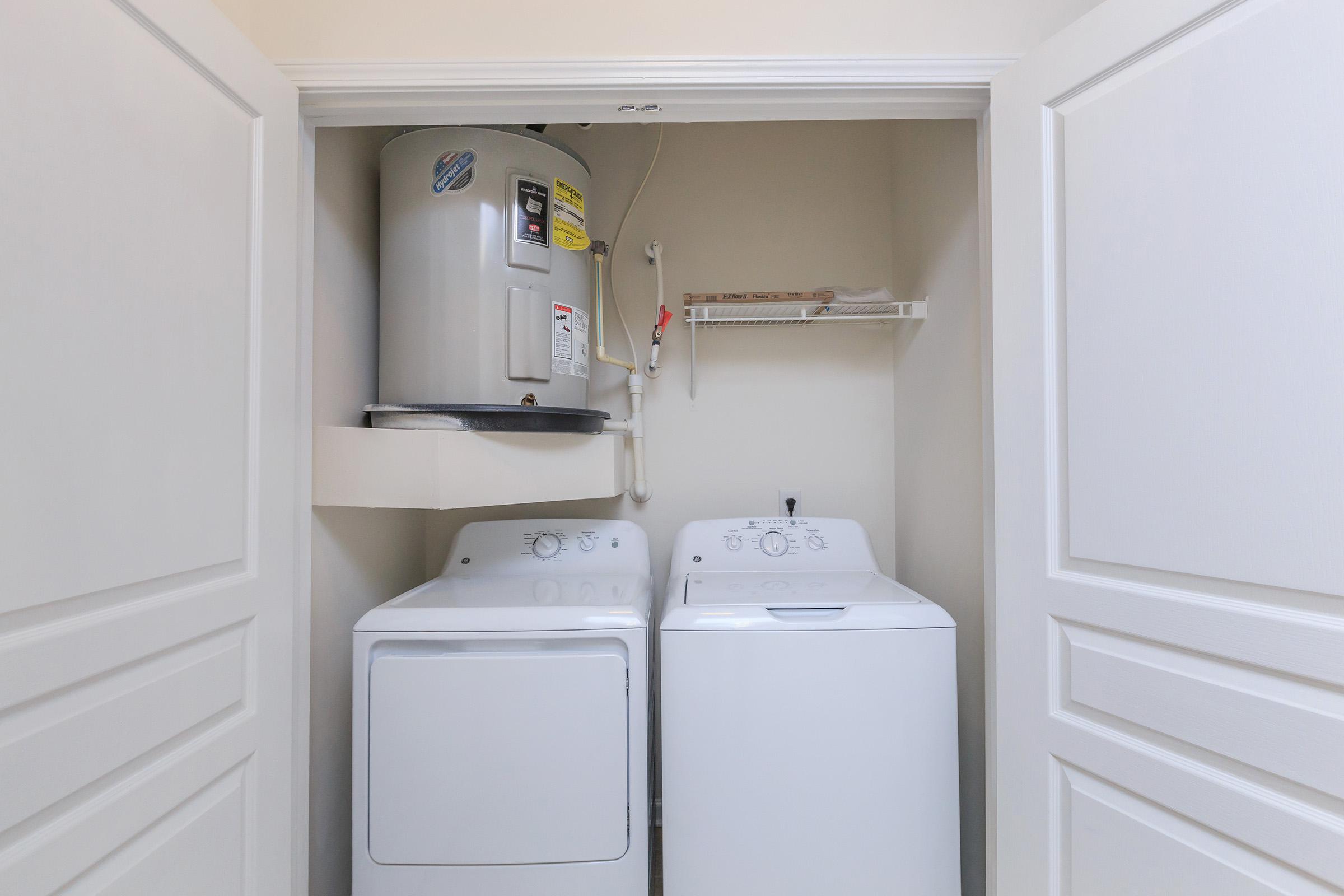 a white refrigerator freezer sitting inside of a kitchen