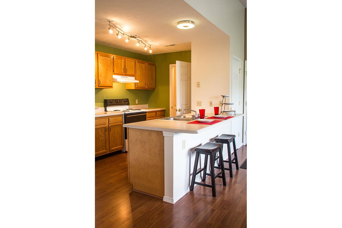 a kitchen with a wood floor