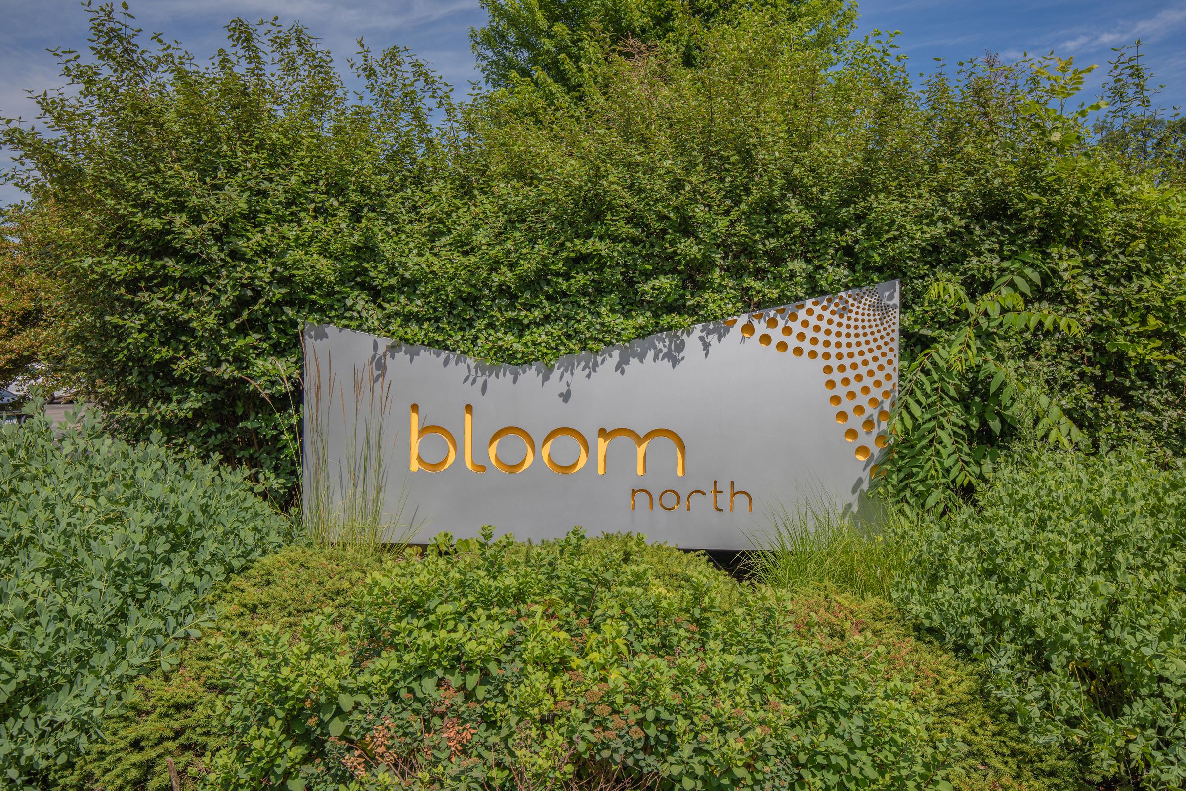 Sign for Bloom apartments in Bloomington Indianan