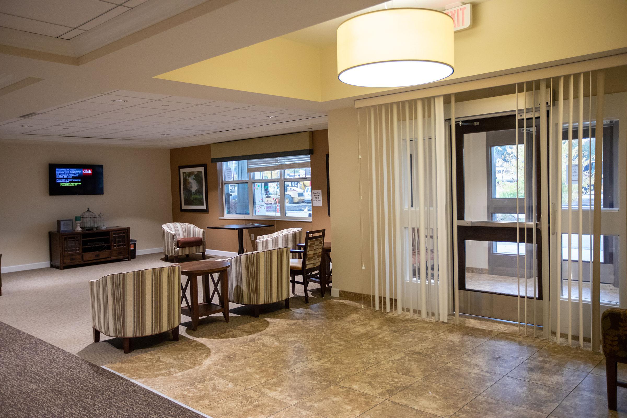 a room filled with furniture and a large window