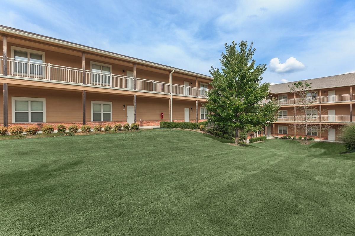 a large lawn in front of a house