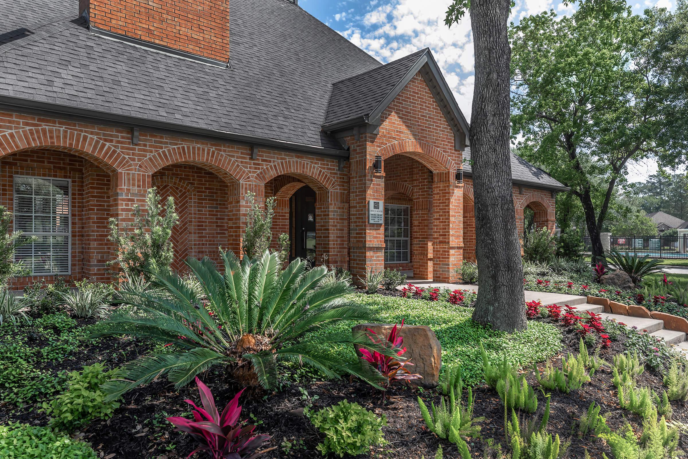 Spring Park leasing office with green trees