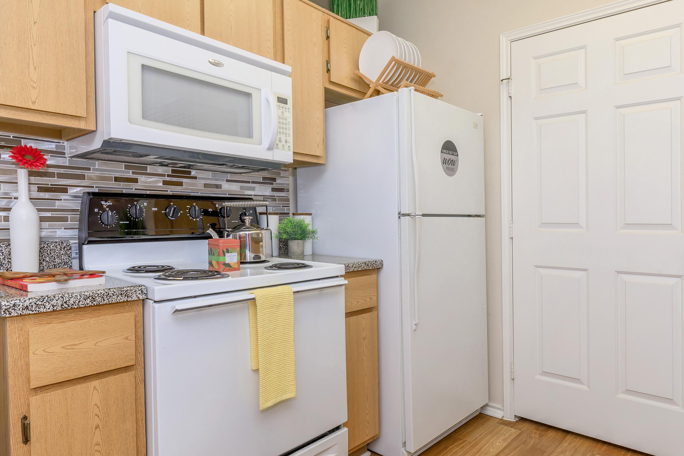 a kitchen with a stove top oven sitting inside of a refrigerator