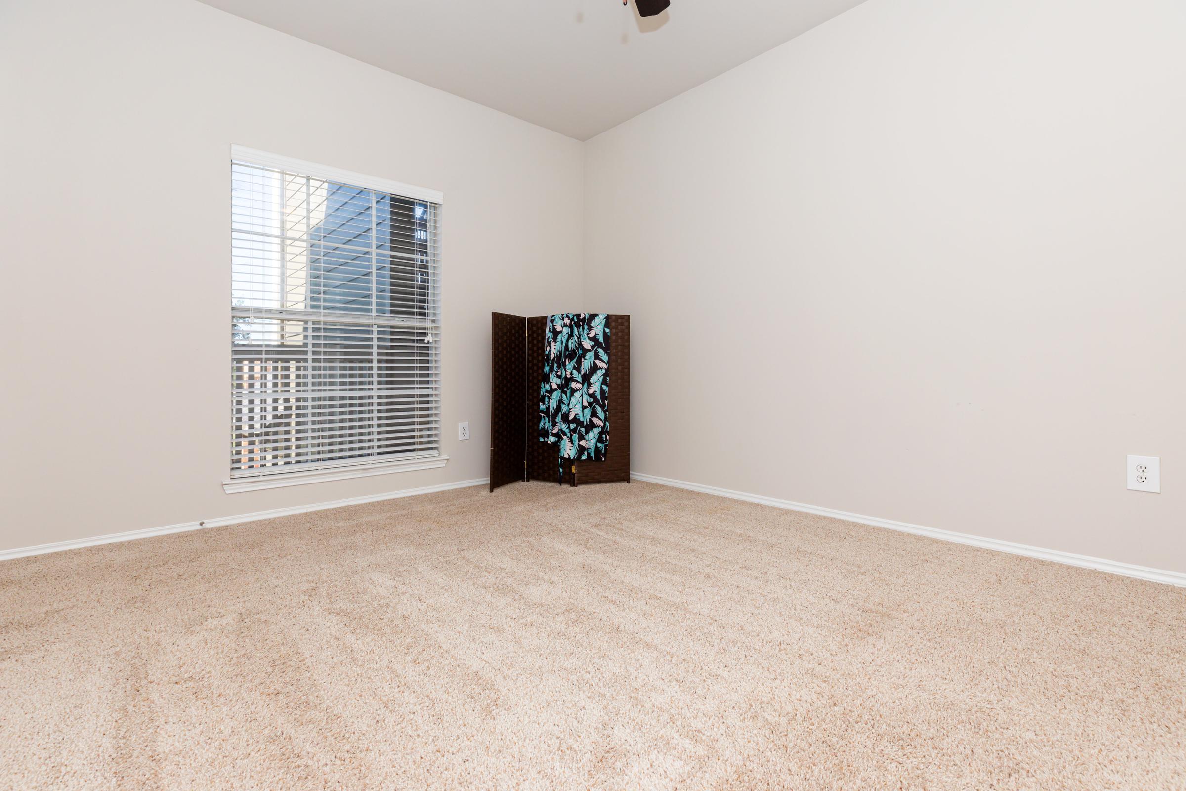 carpeted unfurnished bedroom