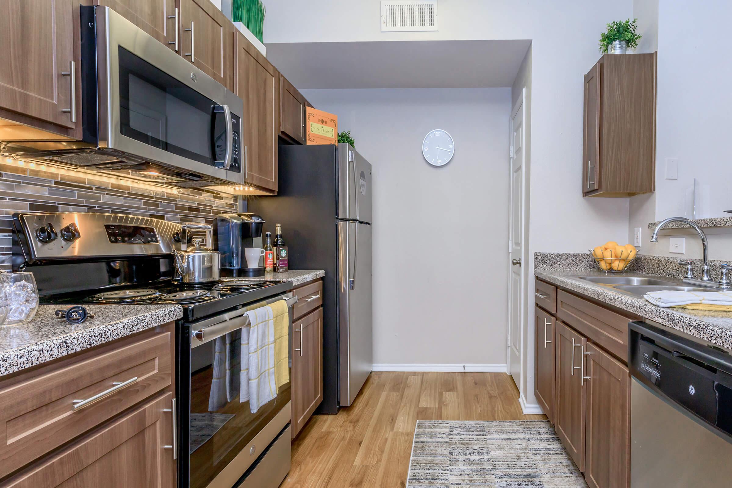 a large kitchen with stainless steel appliances