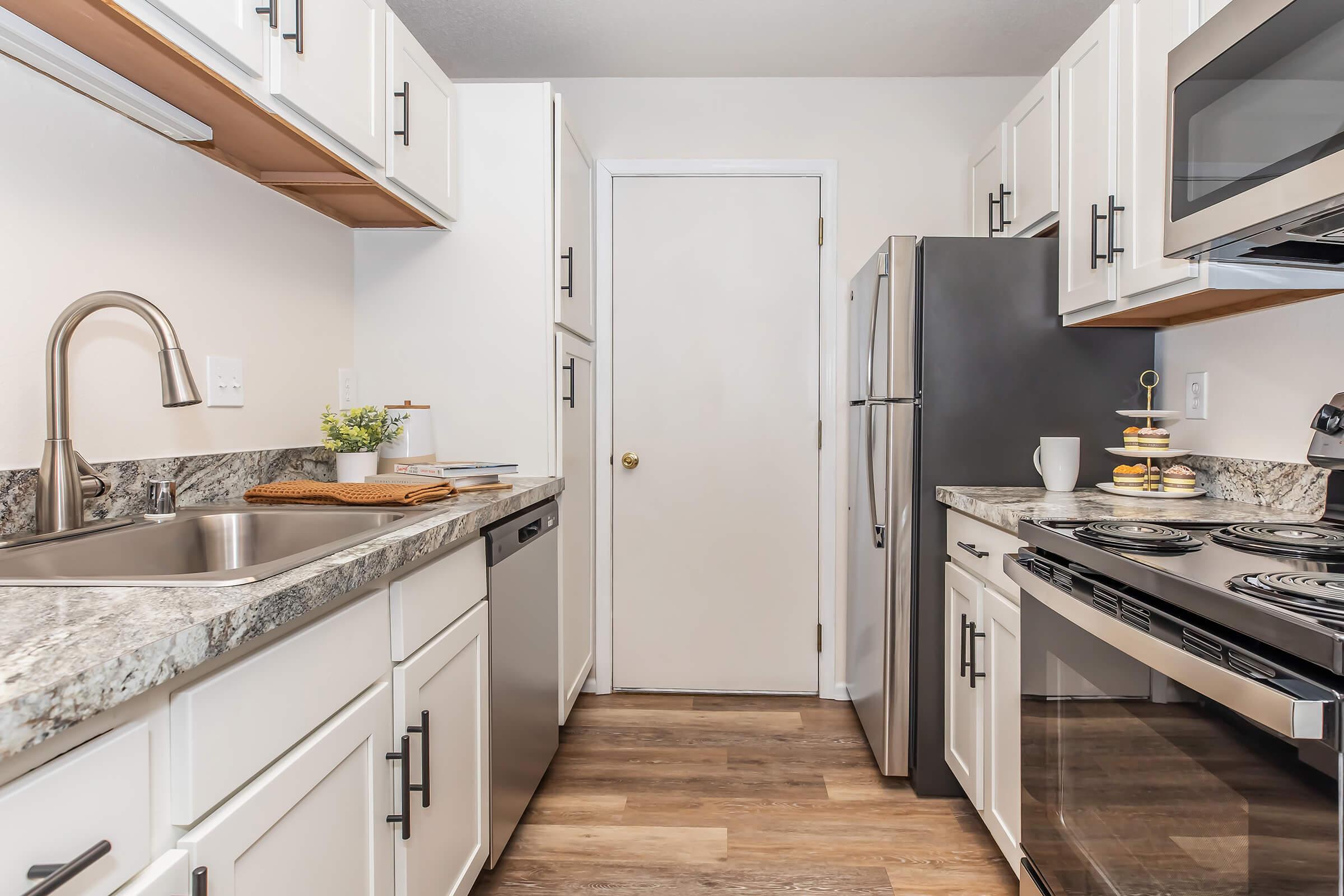 a large kitchen with stainless steel appliances