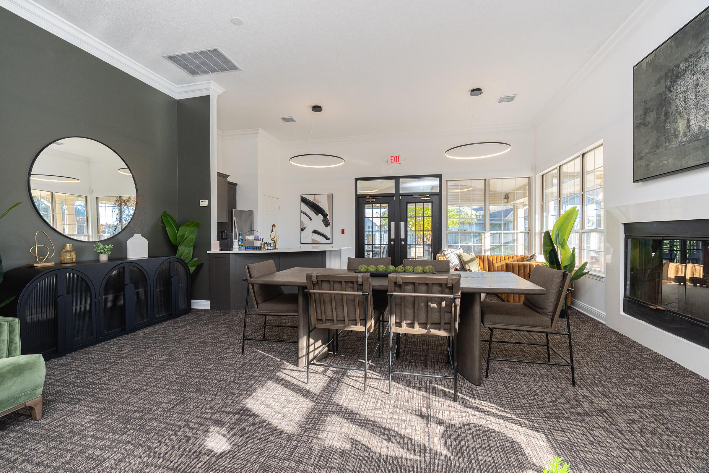 a living room filled with furniture and a large window