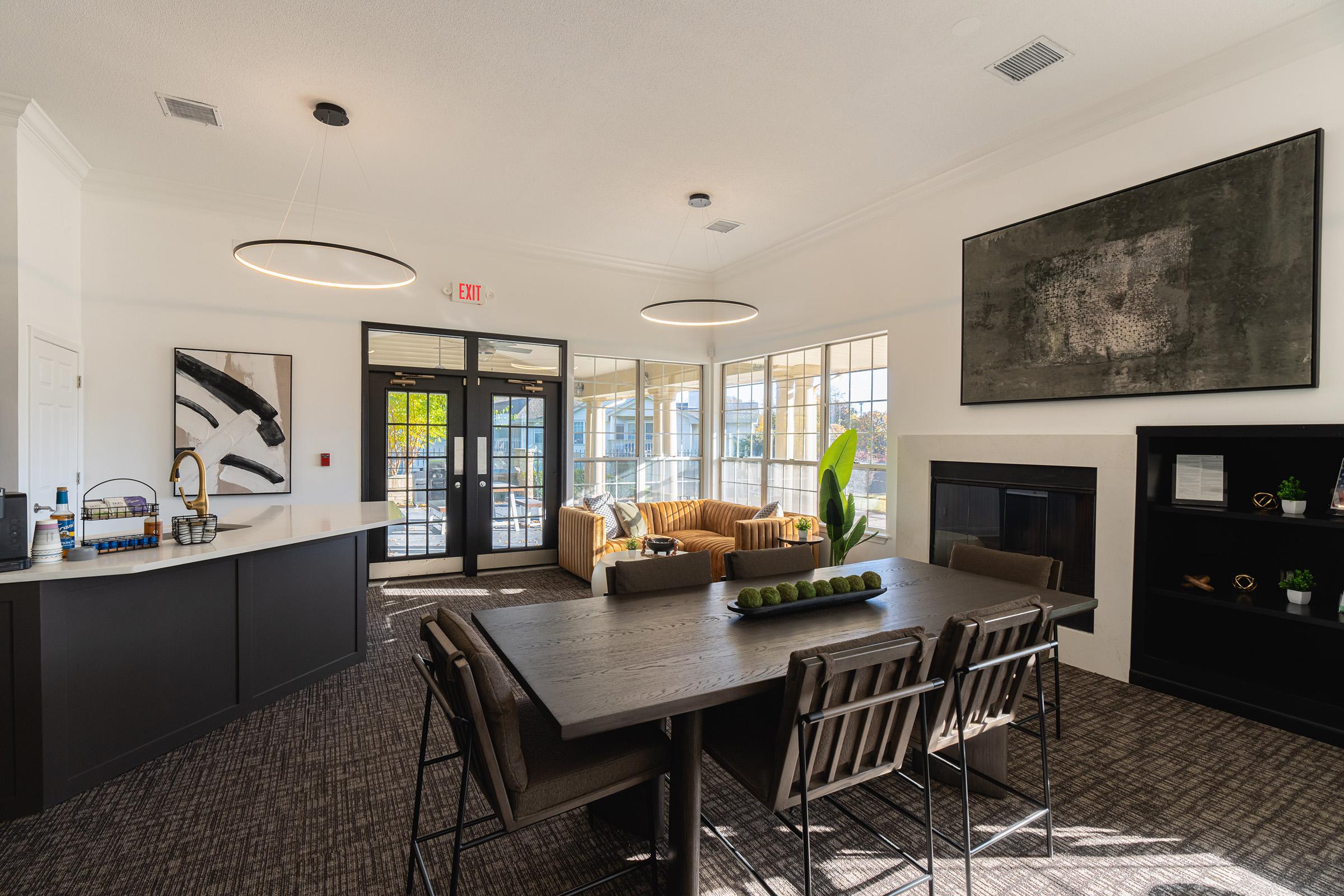 a kitchen with a table in a living room