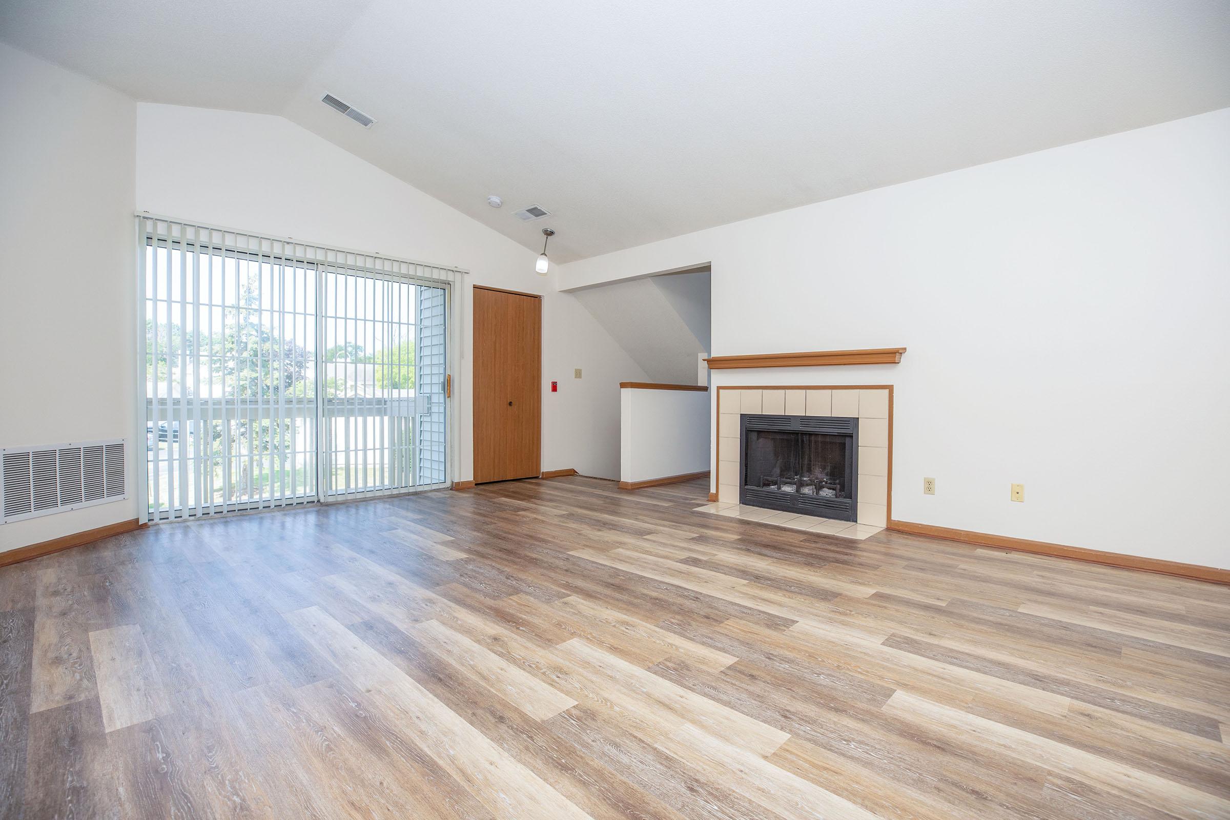 a large empty room with a wooden floor