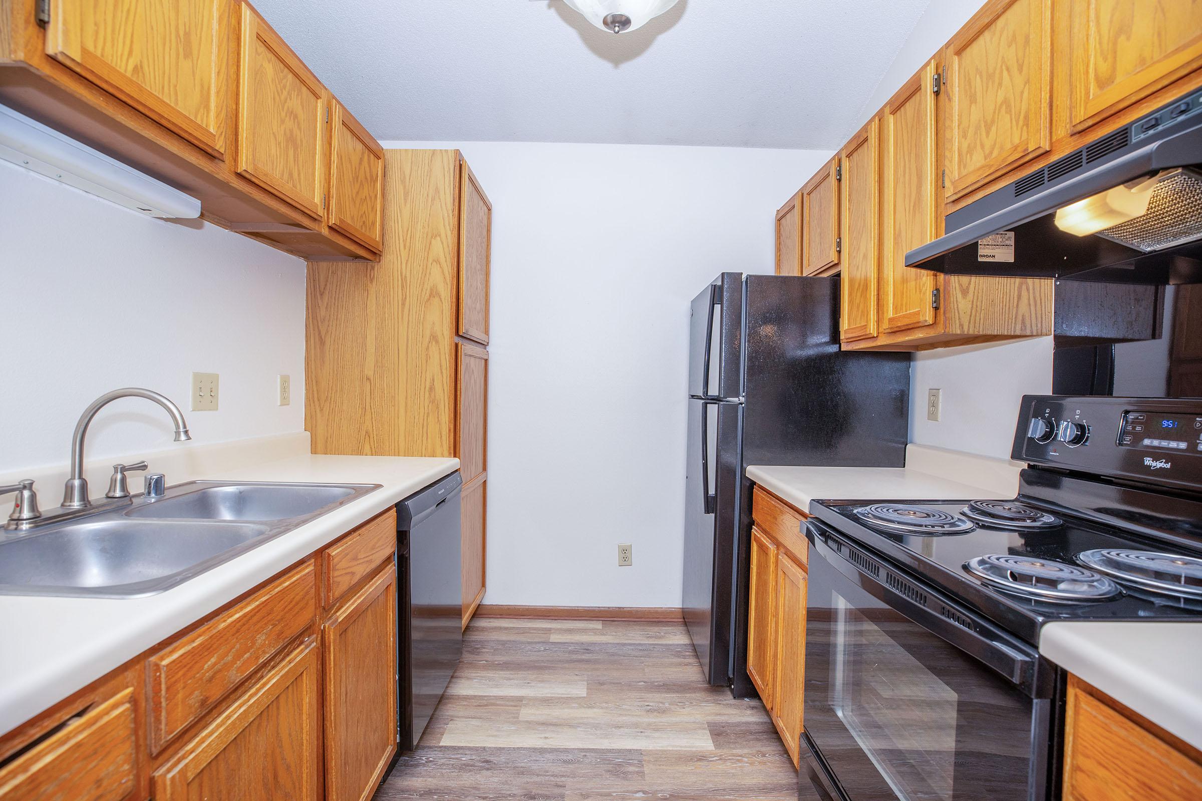 a kitchen with a stove top oven