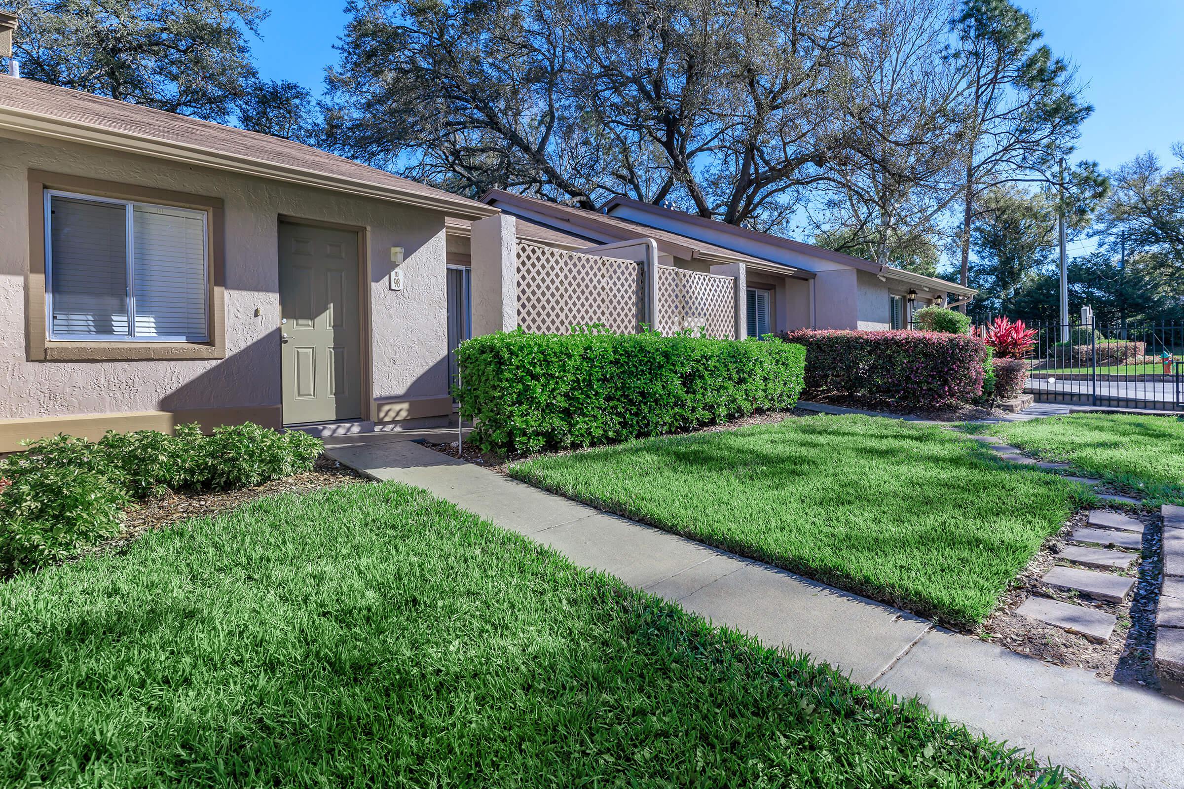 a large lawn in front of a house