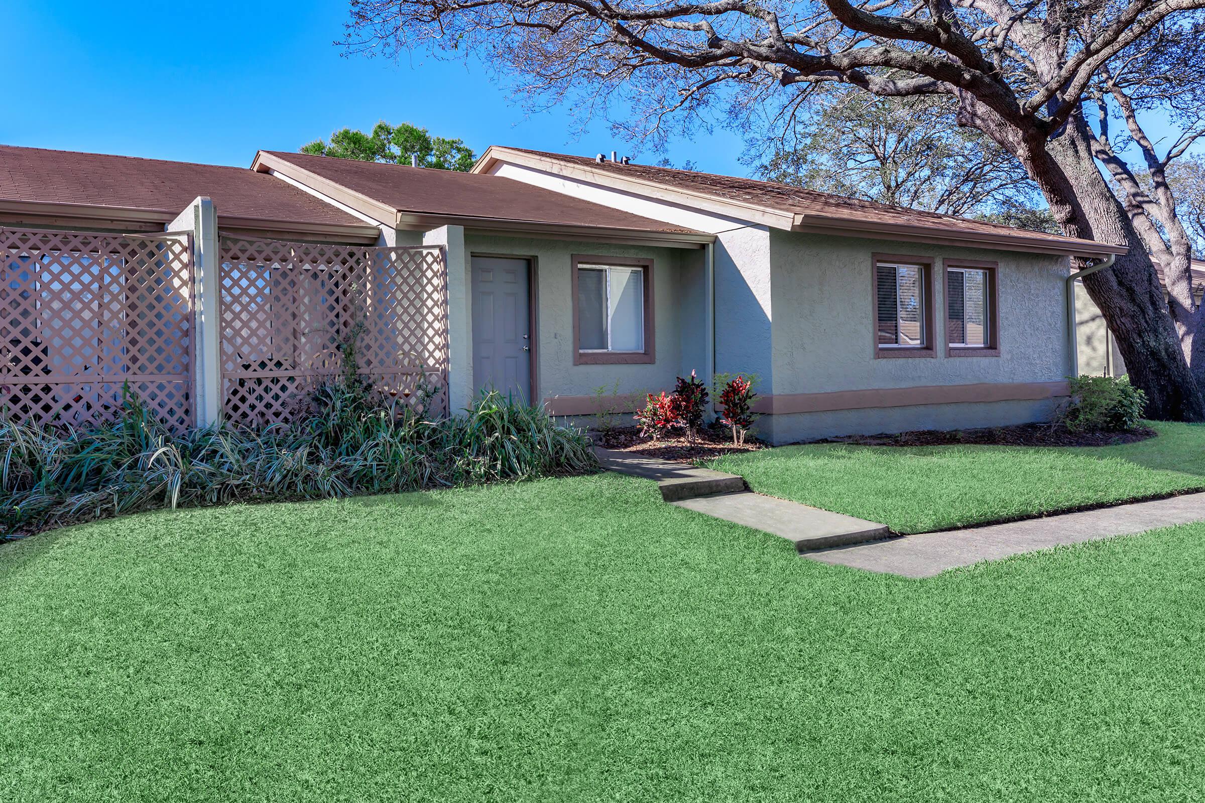 a large lawn in front of a house