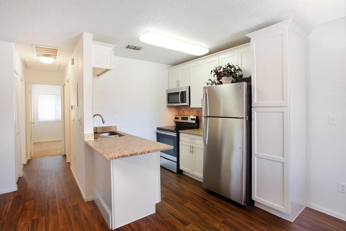 a kitchen with a wood floor