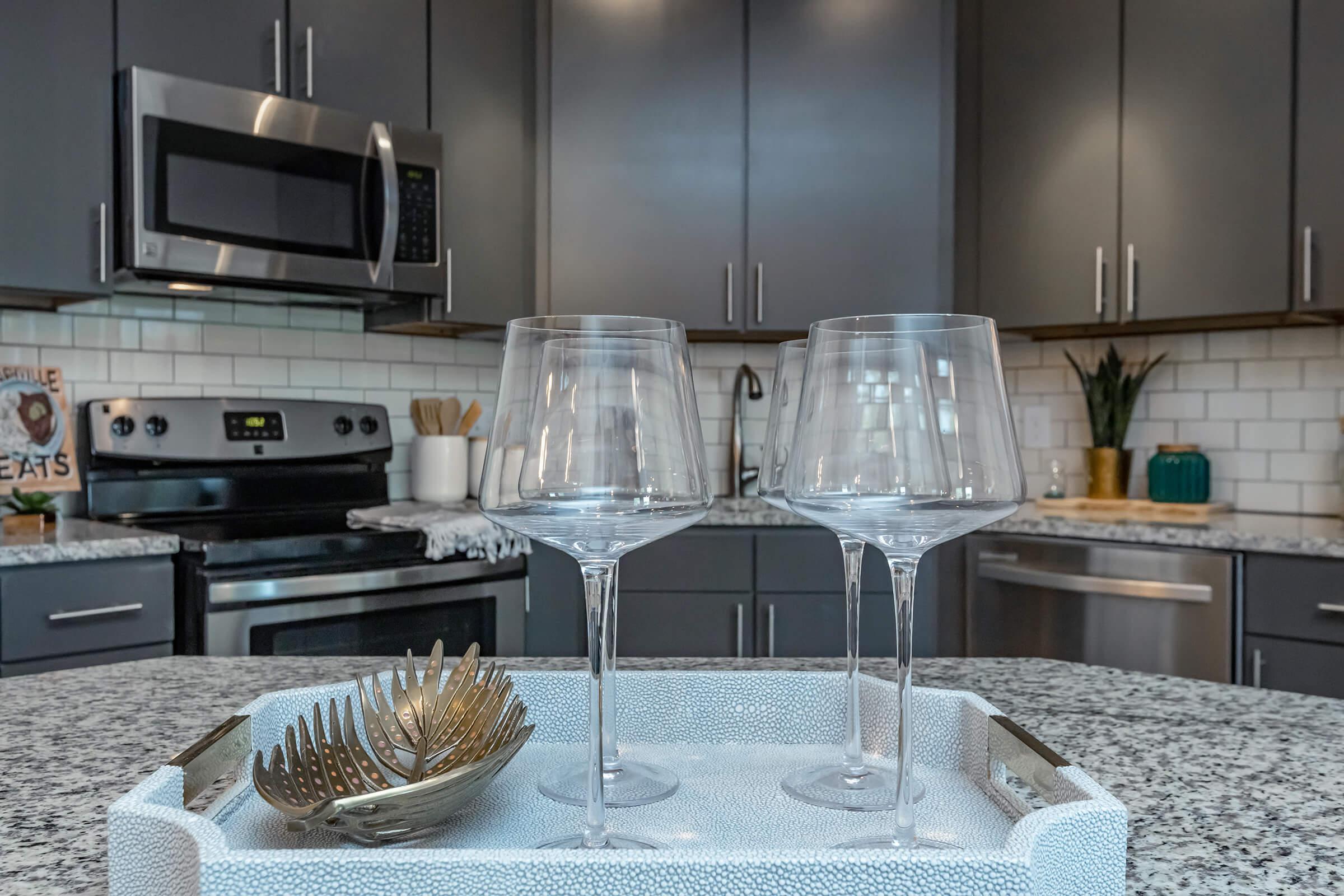 Modern grey cabinetry with brushed nickel fixtures at The Residence at Old Hickory Lake