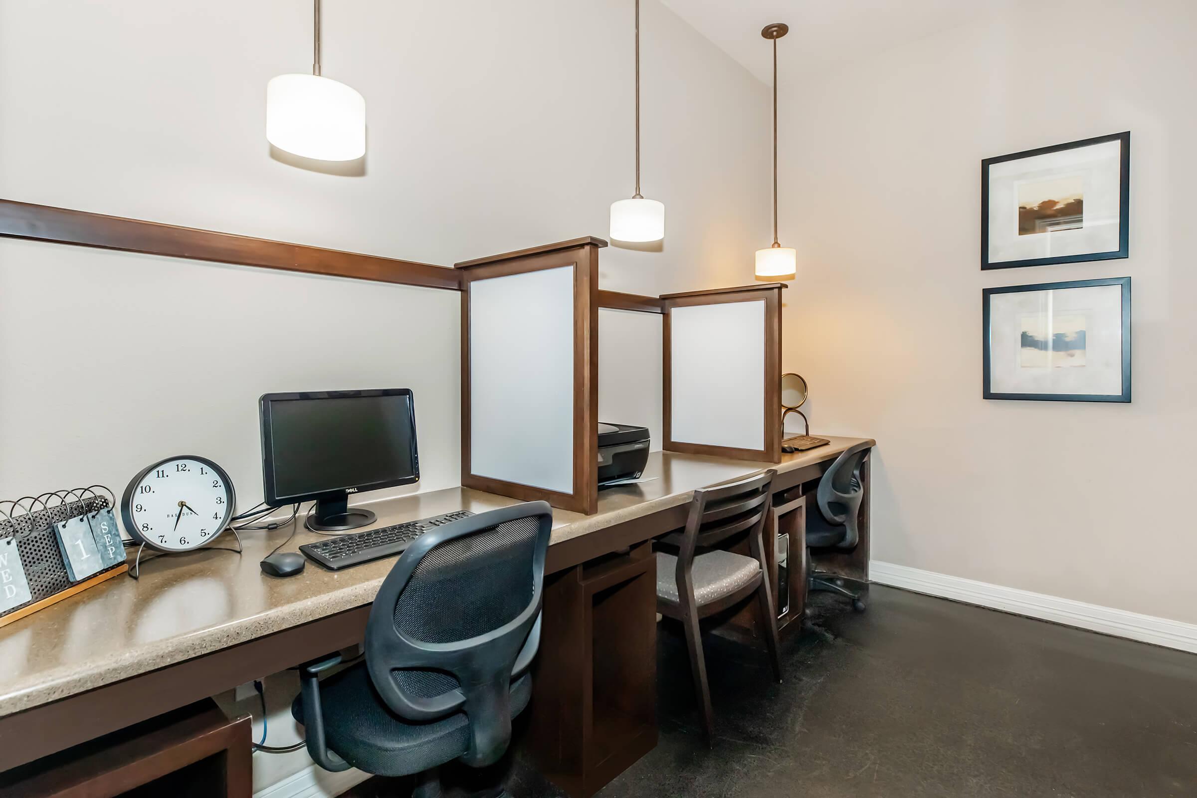 a bedroom with a bed and desk in a room