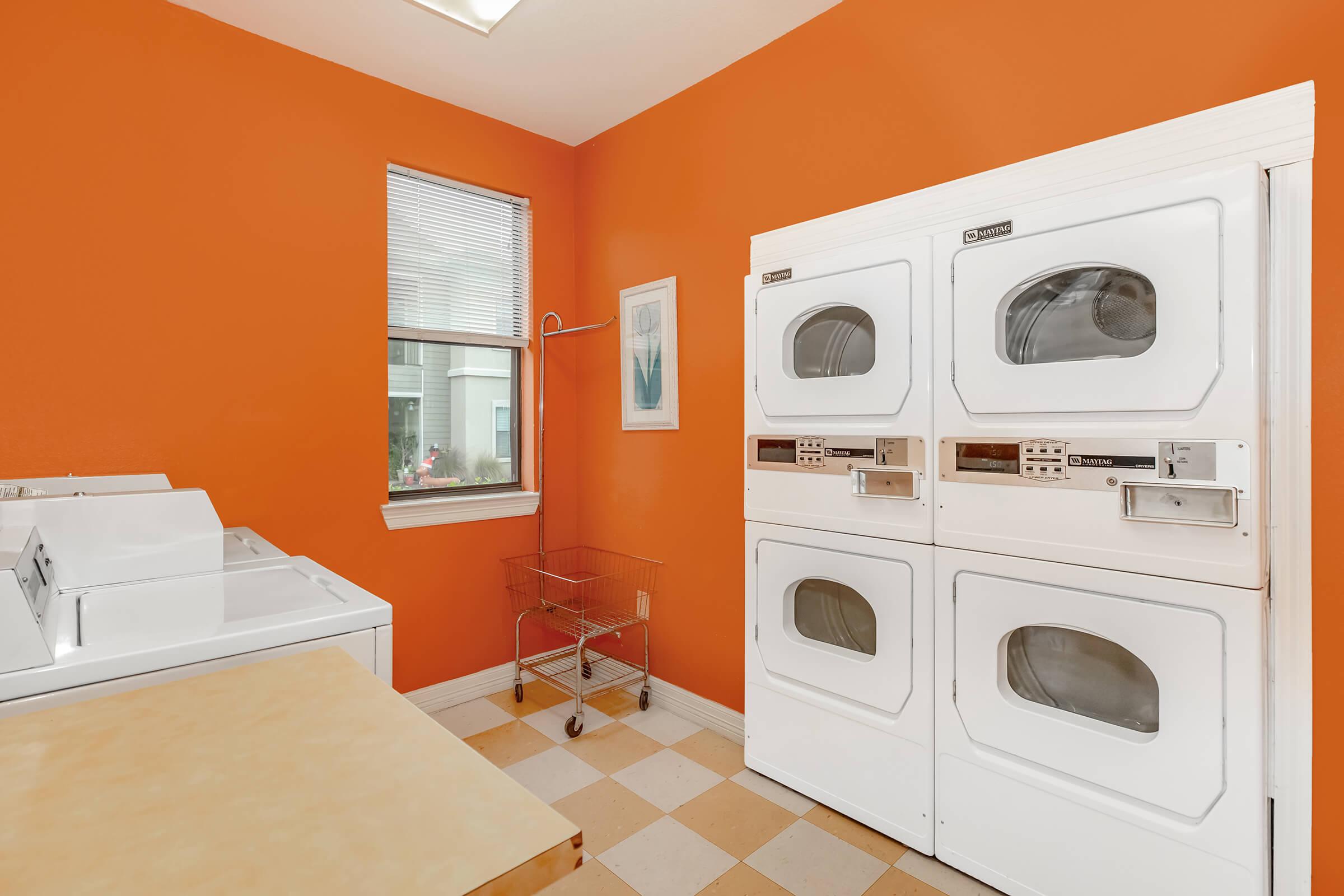 a kitchen with a sink and a mirror