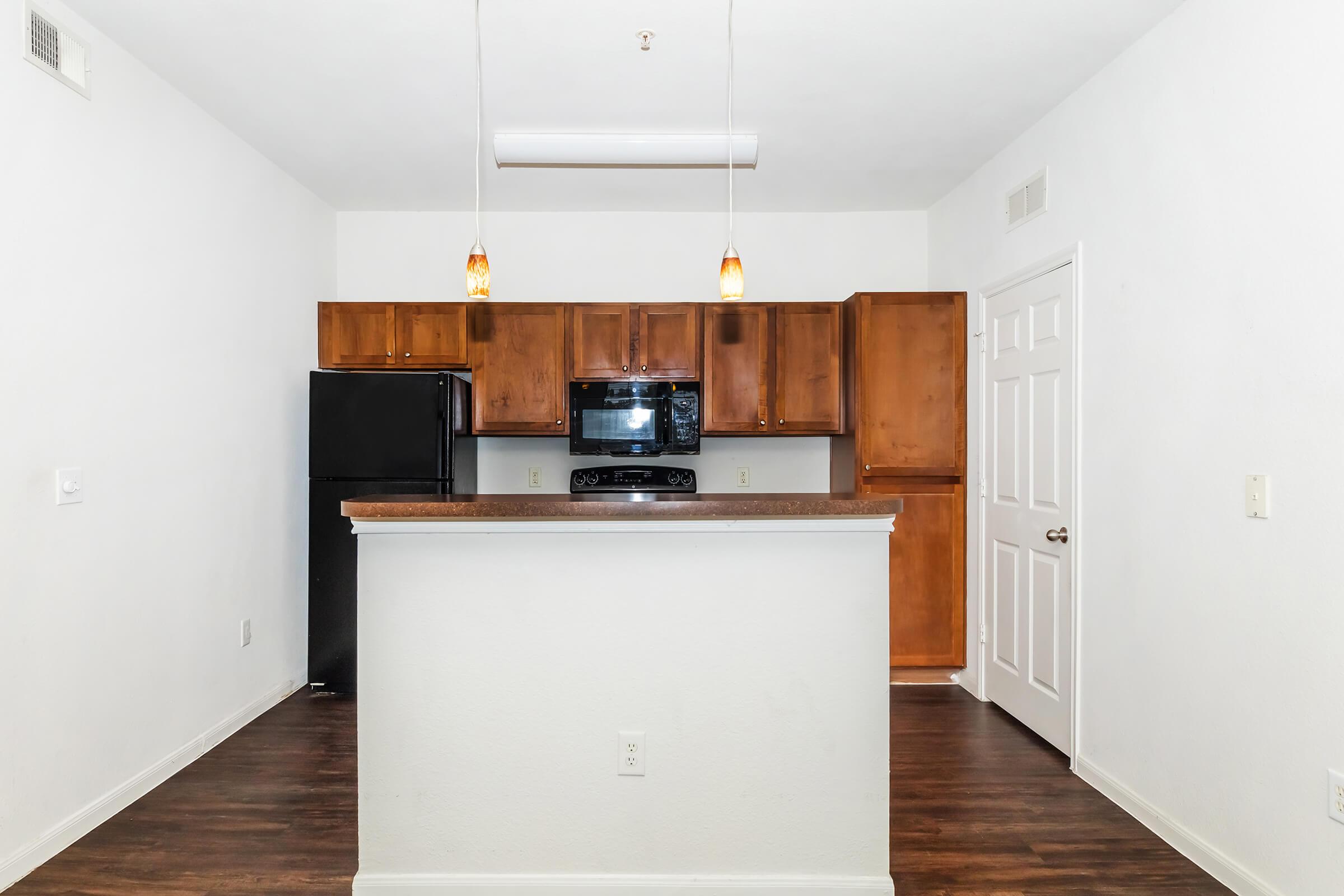 a kitchen with a wood floor