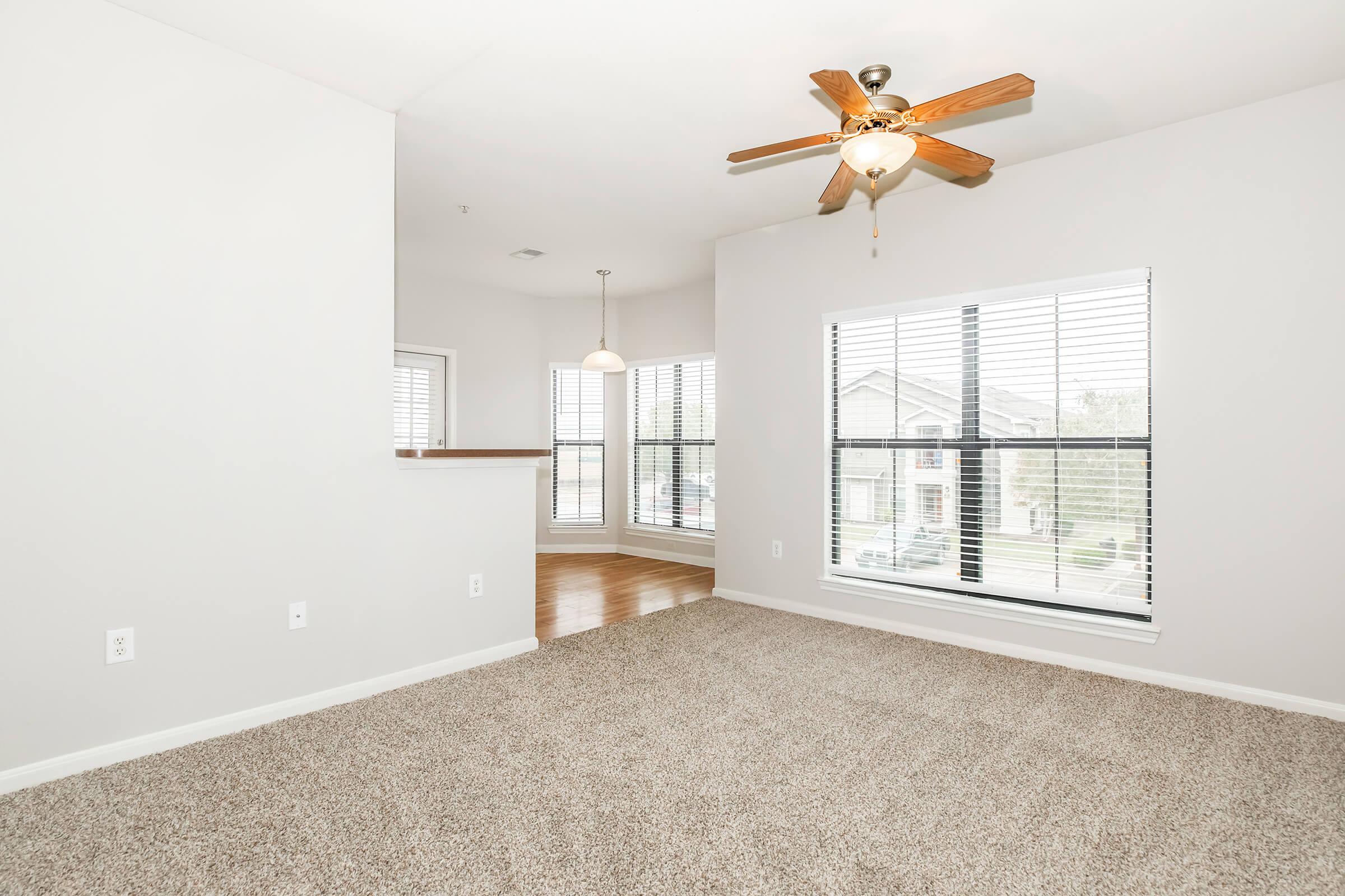 a bedroom with a large window