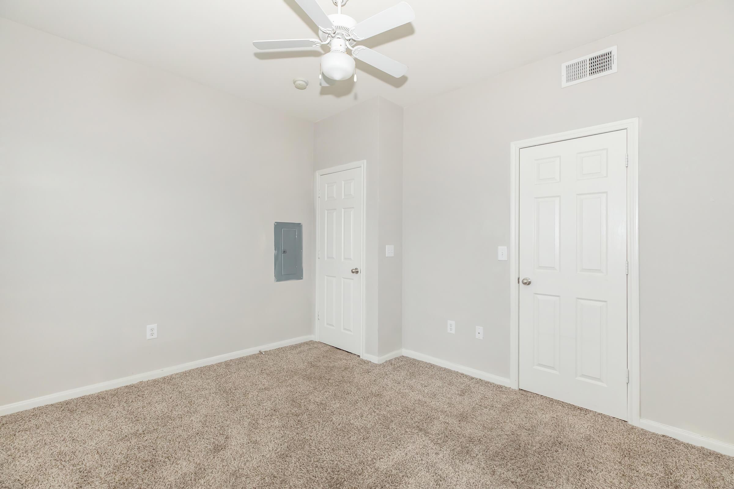 a bedroom with a large mirror