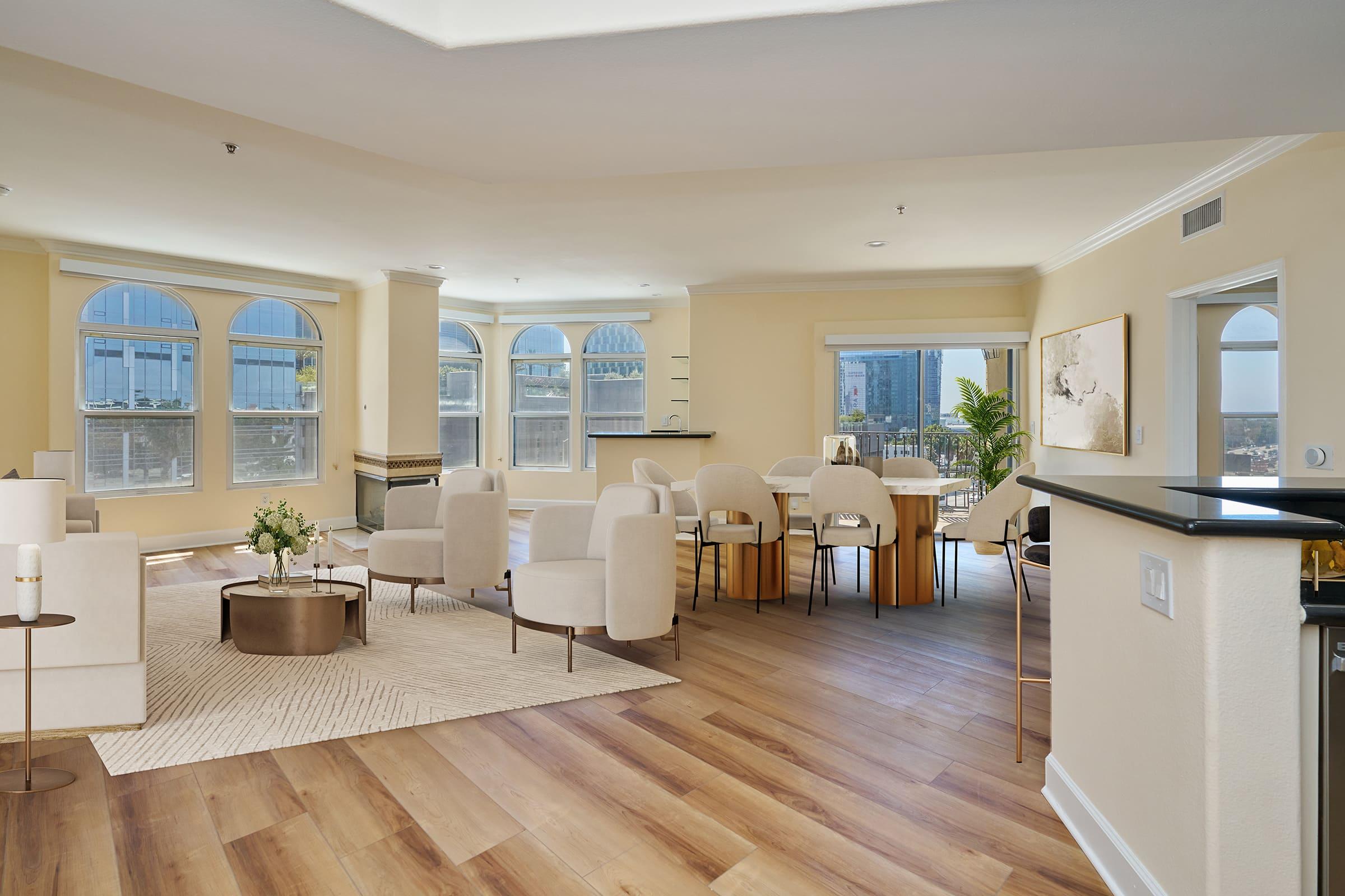 a living room filled with furniture and a large window