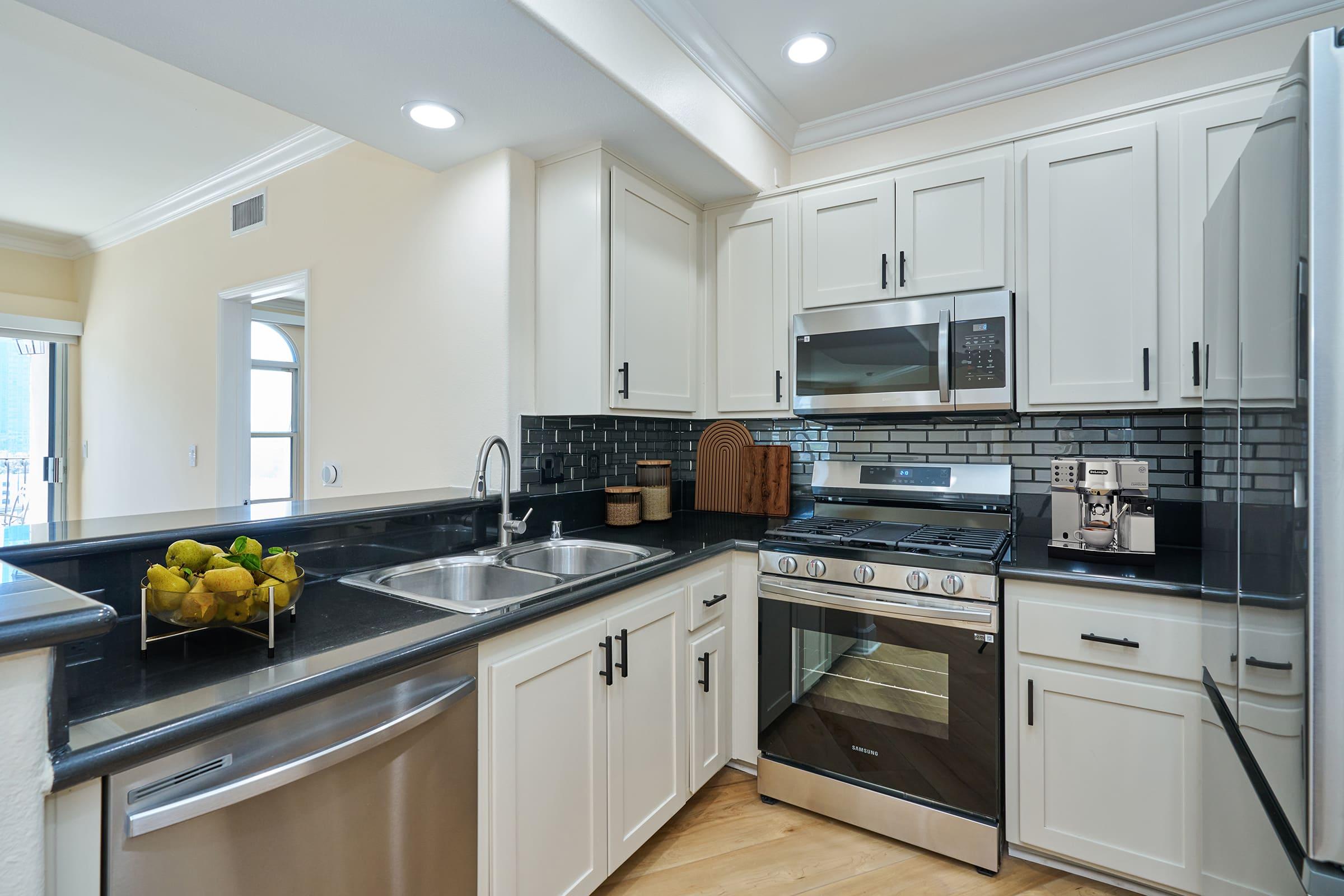 a large kitchen with stainless steel appliances