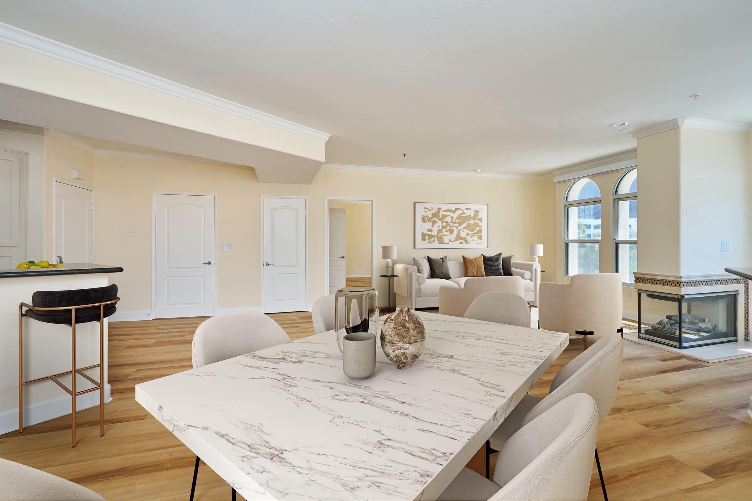 a living room filled with furniture and a large window