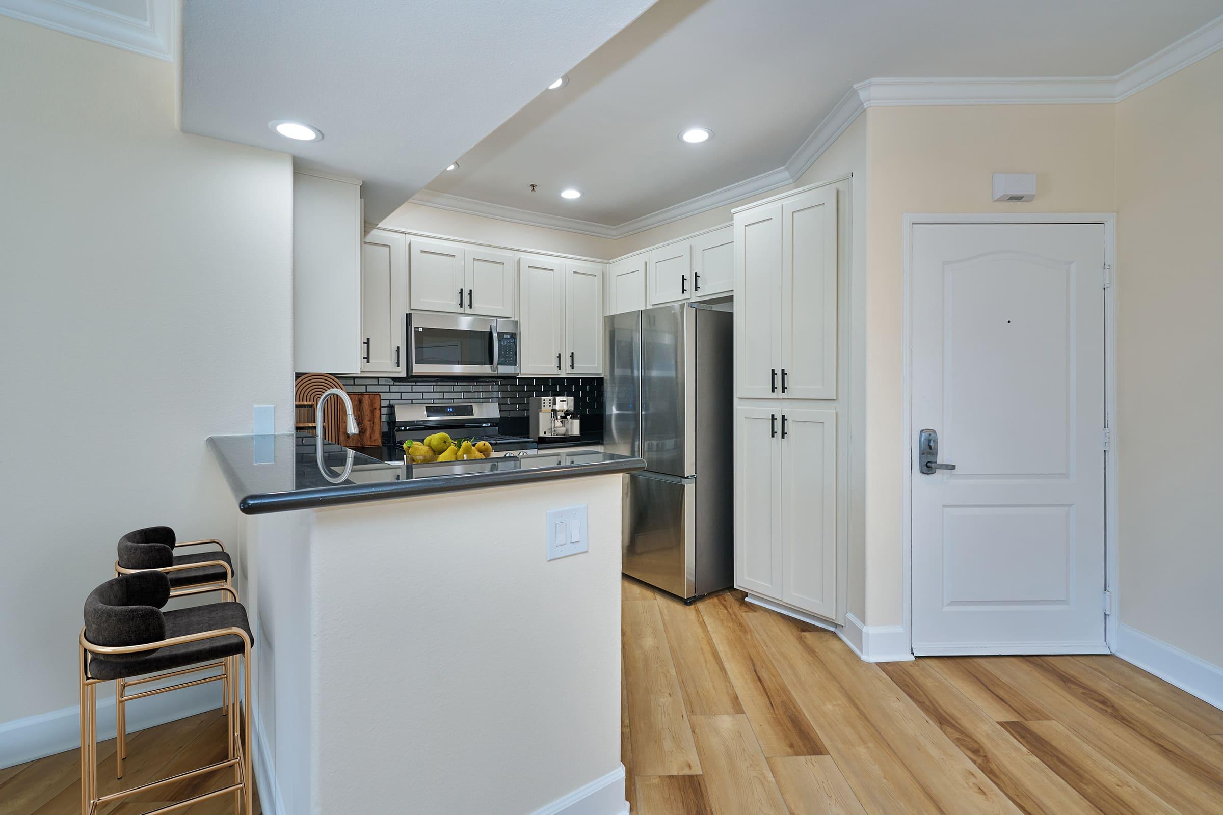 a stainless steel refrigerator in a kitchen