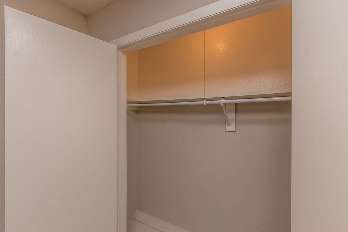open closet with a shelf
