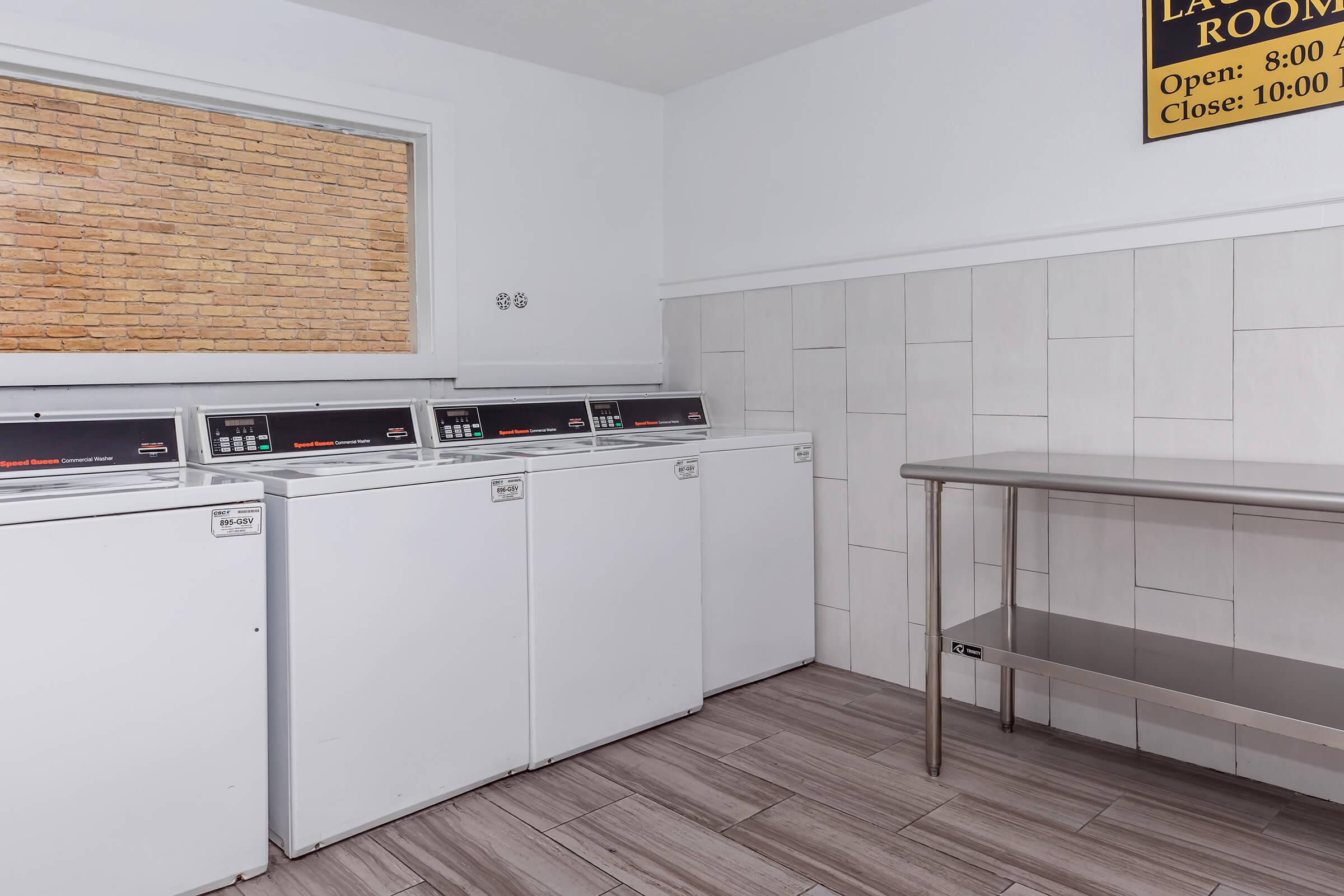 a kitchen with wooden cabinets