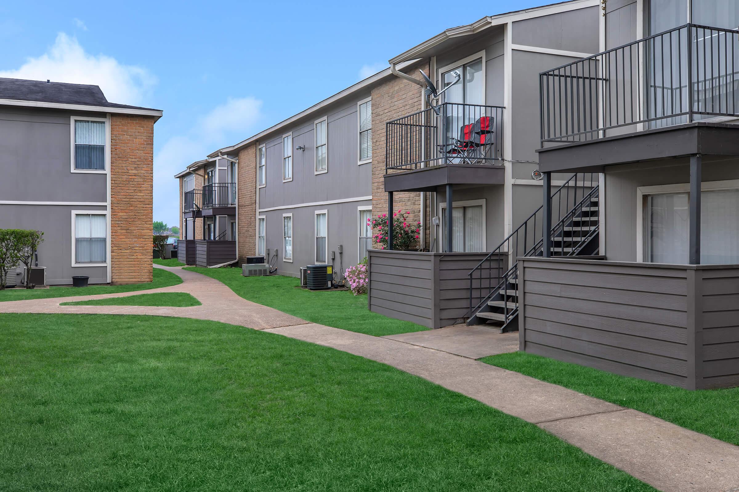 a large lawn in front of a house