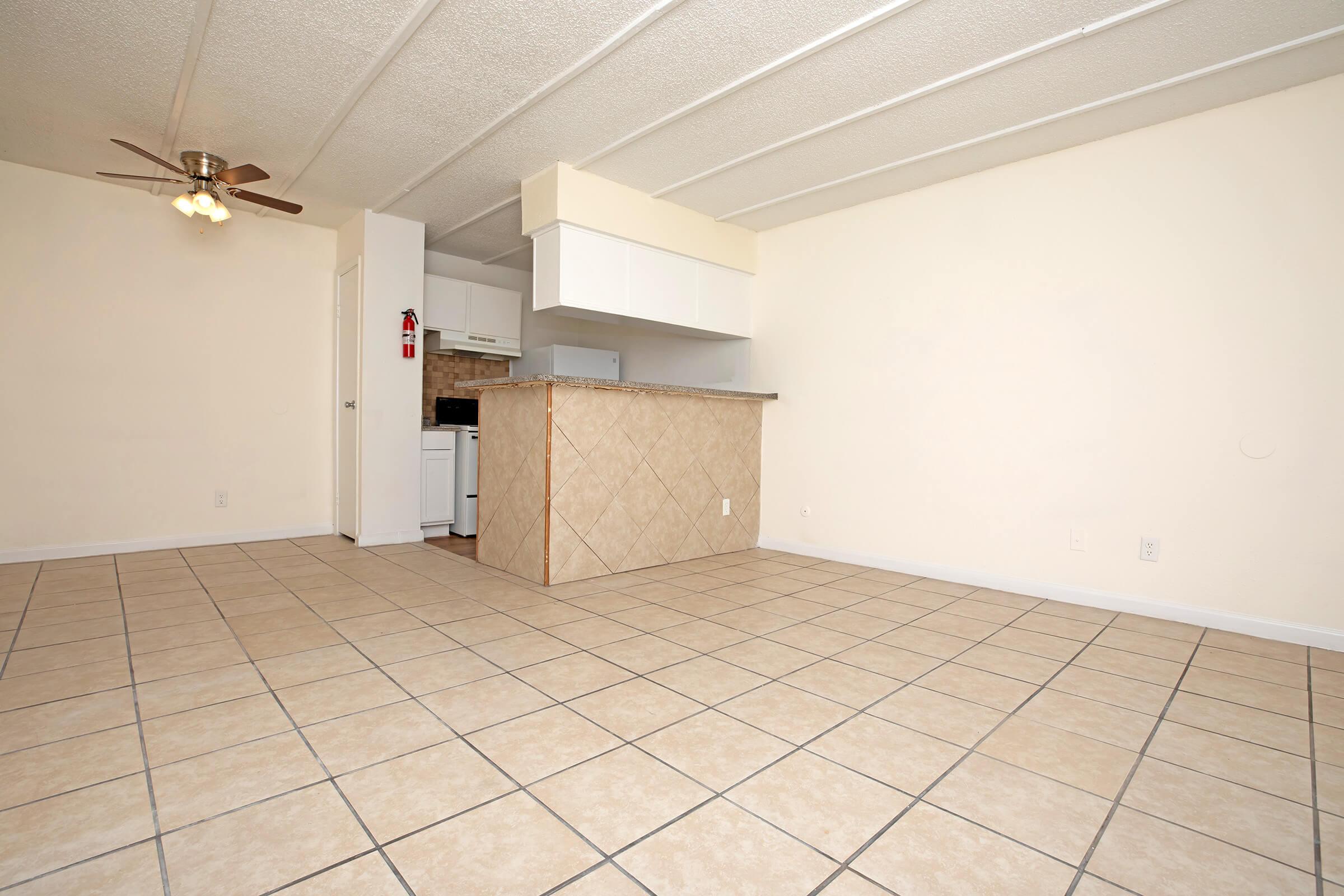 a kitchen with a tiled floor