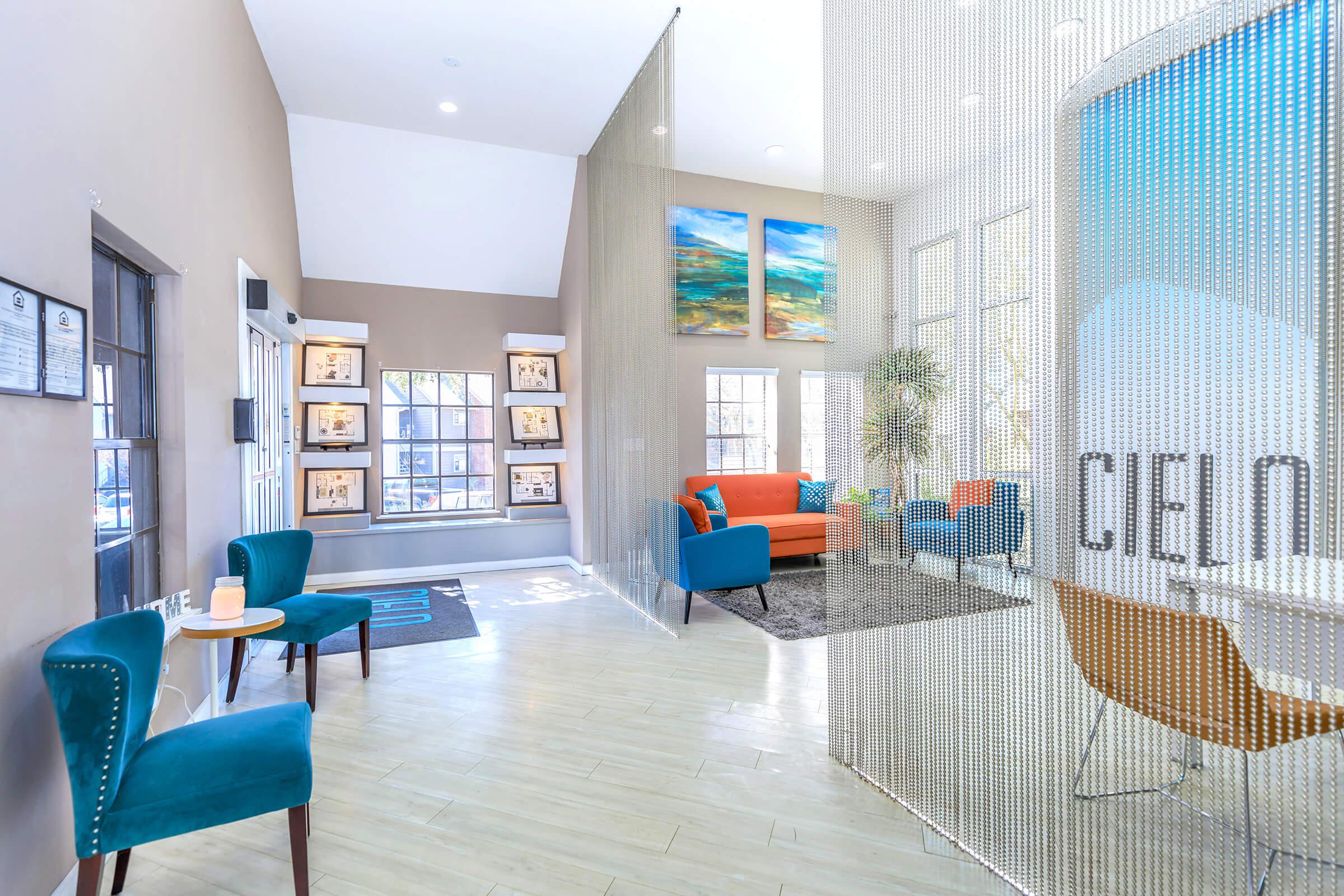 a living room filled with furniture and a window