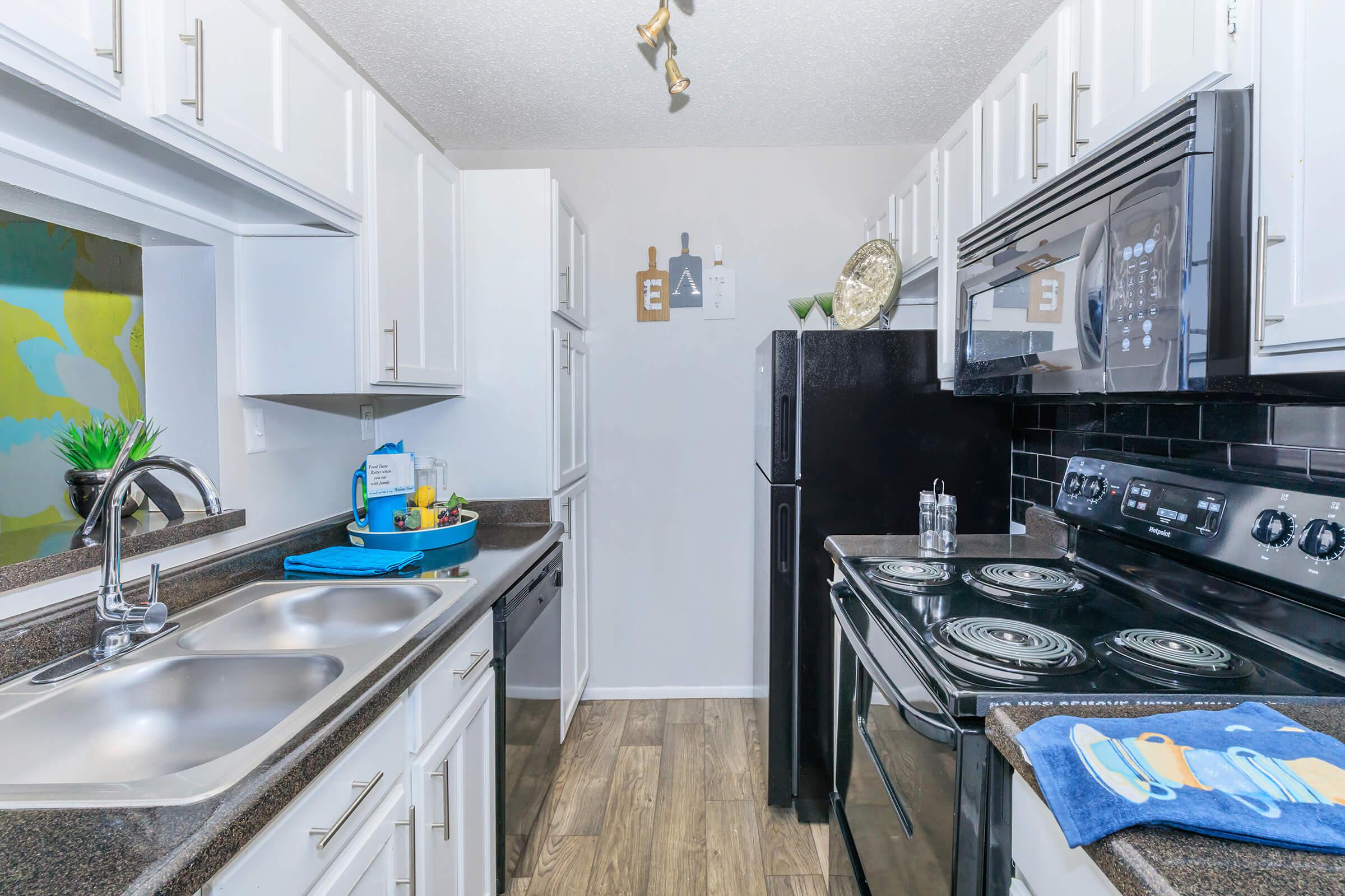 a large kitchen with stainless steel appliances