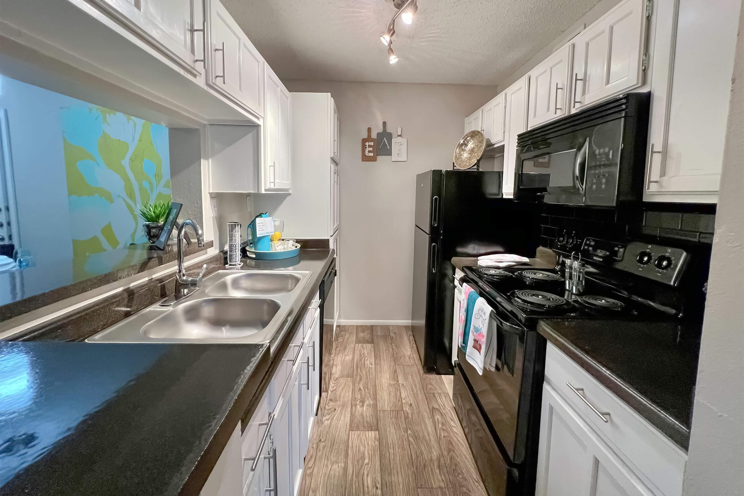 a large kitchen with stainless steel appliances